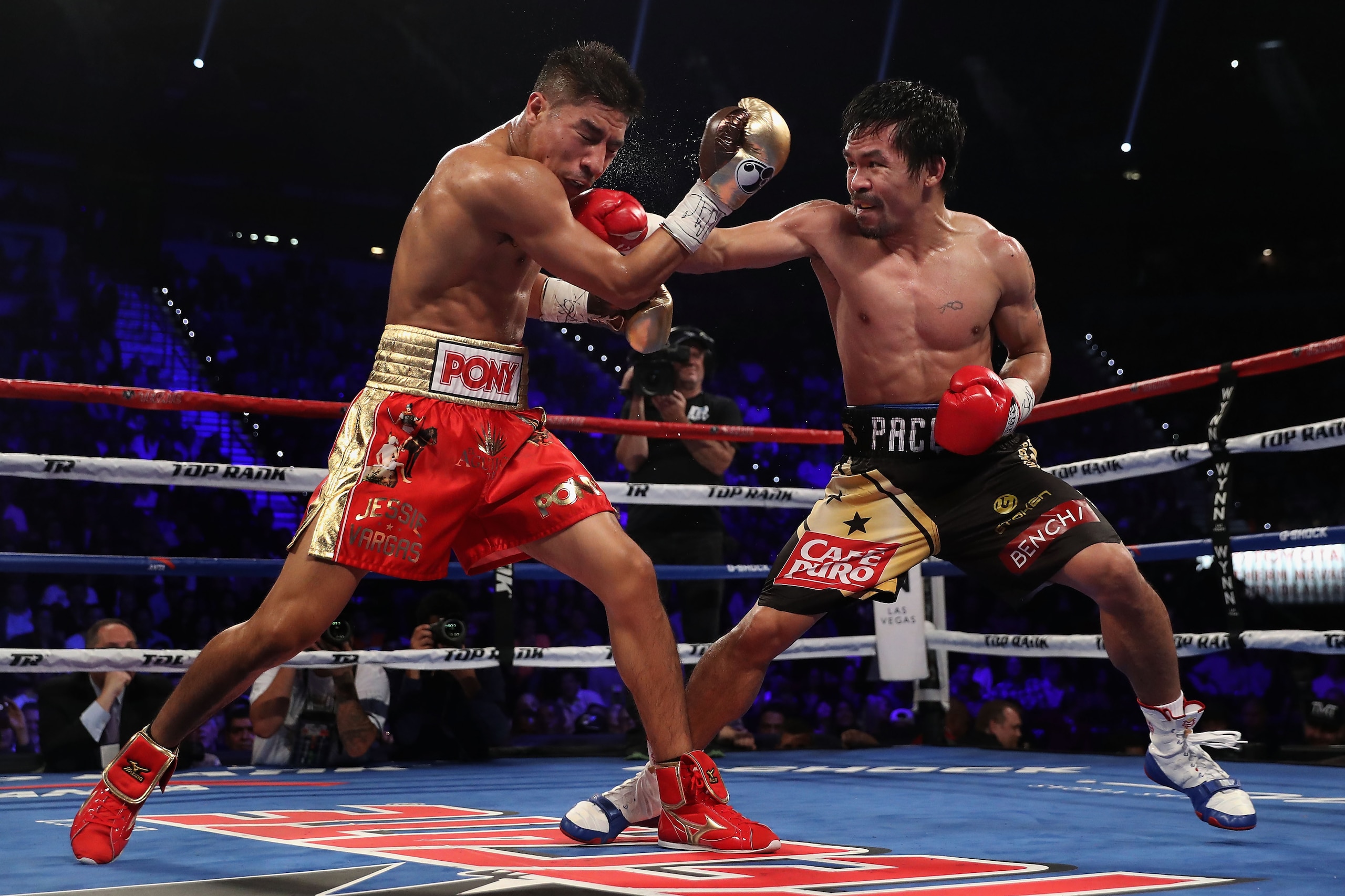 LAS VEGAS, NV - NOVEMBER 05:  Manny Pacquiao (R) lands a right on Jessie Vargas during their WBO welterweight championship fight at the Thomas & Mack Center on November 5, 2016 in Las Vegas, Nevada.  (Photo by Christian Petersen/Getty Images)
