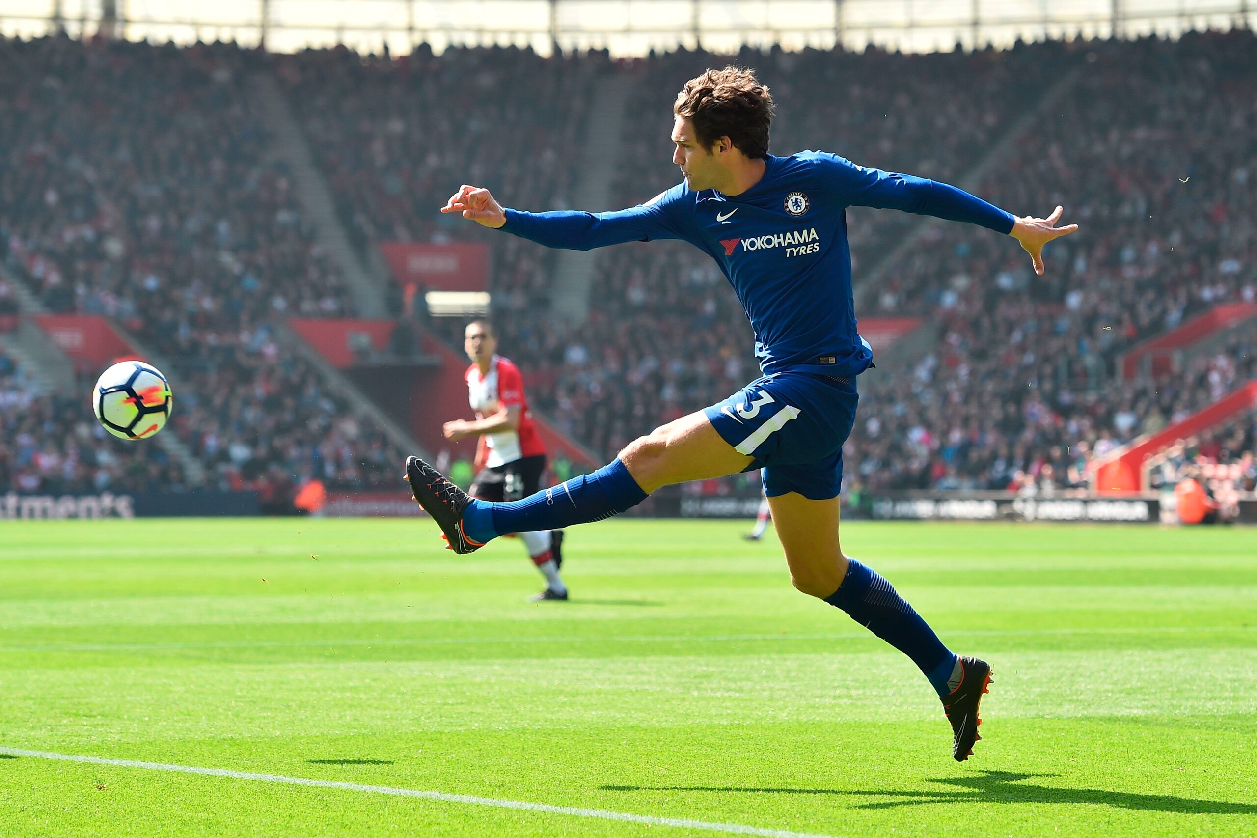 Chelsea's Spanish defender Marcos Alonso plays the ball during the English Premier League football match between Southampton and Chelsea at St Mary's Stadium in Southampton, southern England on April 14, 2018. / AFP PHOTO / Glyn KIRK / RESTRICTED TO EDITO