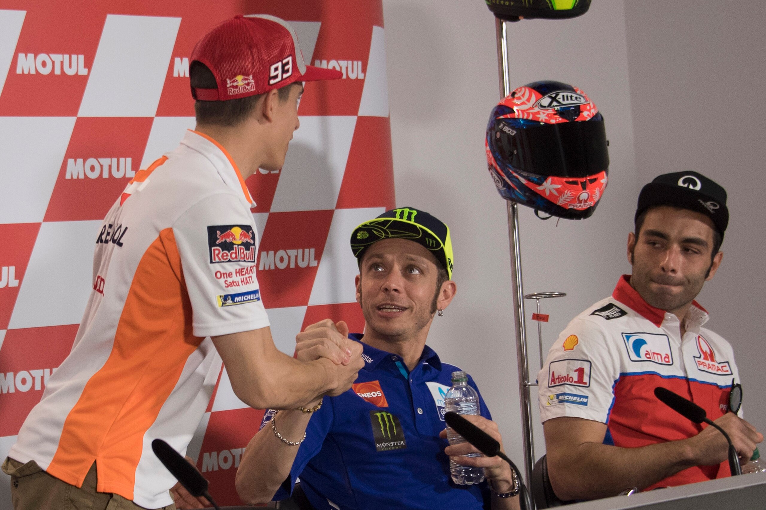 RIO HONDO, ARGENTINA - APRIL 05:  Cal  Marc Marquez of Spain and Repsol Honda Team (L) greets Valentino Rossi of Italy and Movistar Yamaha MotoGP  during the press conference pre-event during the MotoGp of Argentina - Previews on April 5, 2018 in Rio Hond