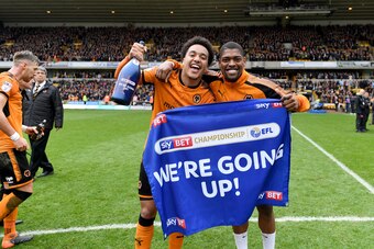 WOLVERHAMPTON, ENGLAND - APRIL 15: Helder Costa of Wolverhampton Wanderers and Ivan Cavaleiro of Wolverhampton Wanderers celebrate promotion to the Premier League during the Sky Bet Championship match between Wolverhampton Wanderers and Birmingham City at