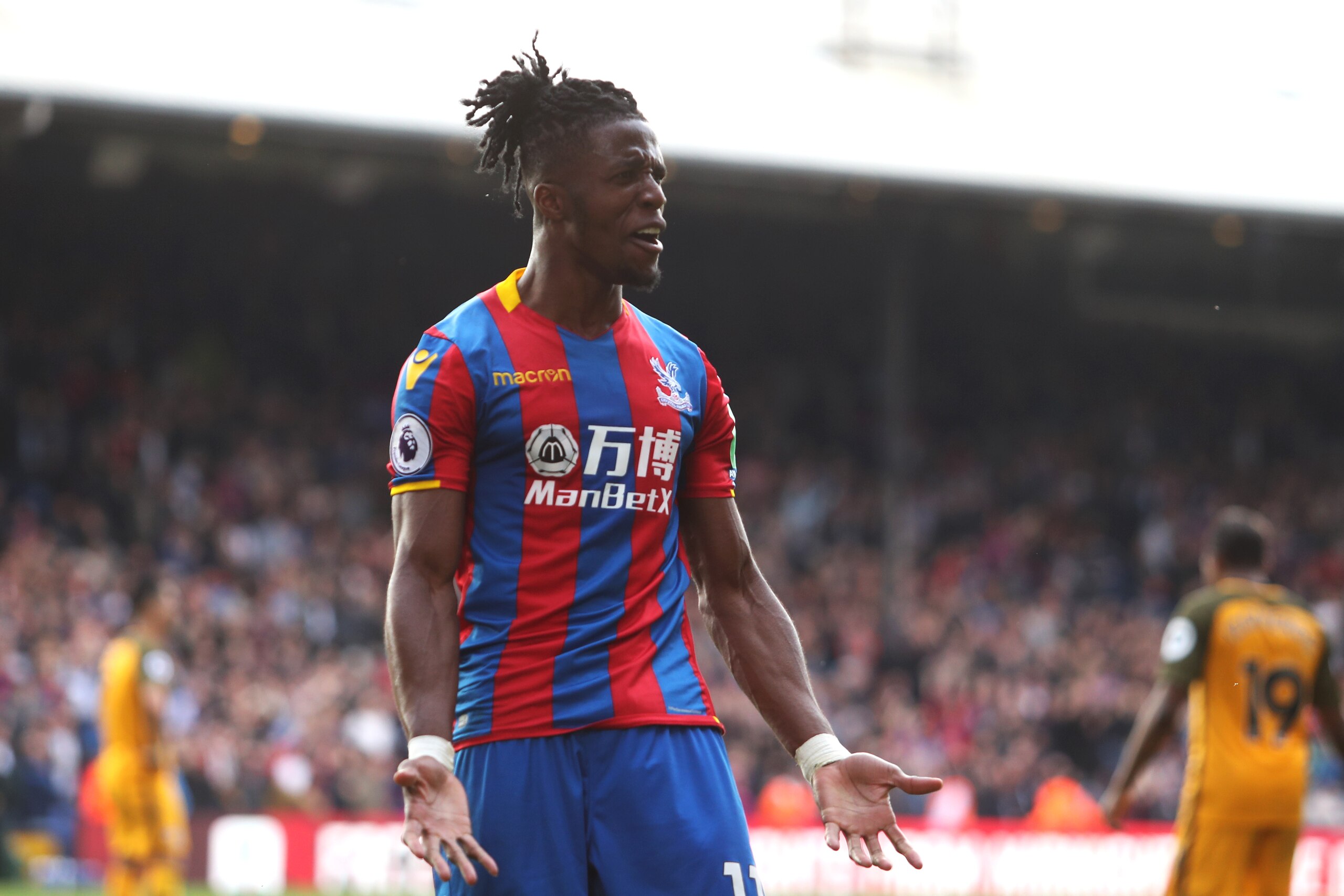 LONDON, ENGLAND - APRIL 14:  Wilfried Zaha of Crystal Palace reacts during the Premier League match between Crystal Palace and Brighton and Hove Albion at Selhurst Park on April 14, 2018 in London, England.  (Photo by Christopher Lee/Getty Images)