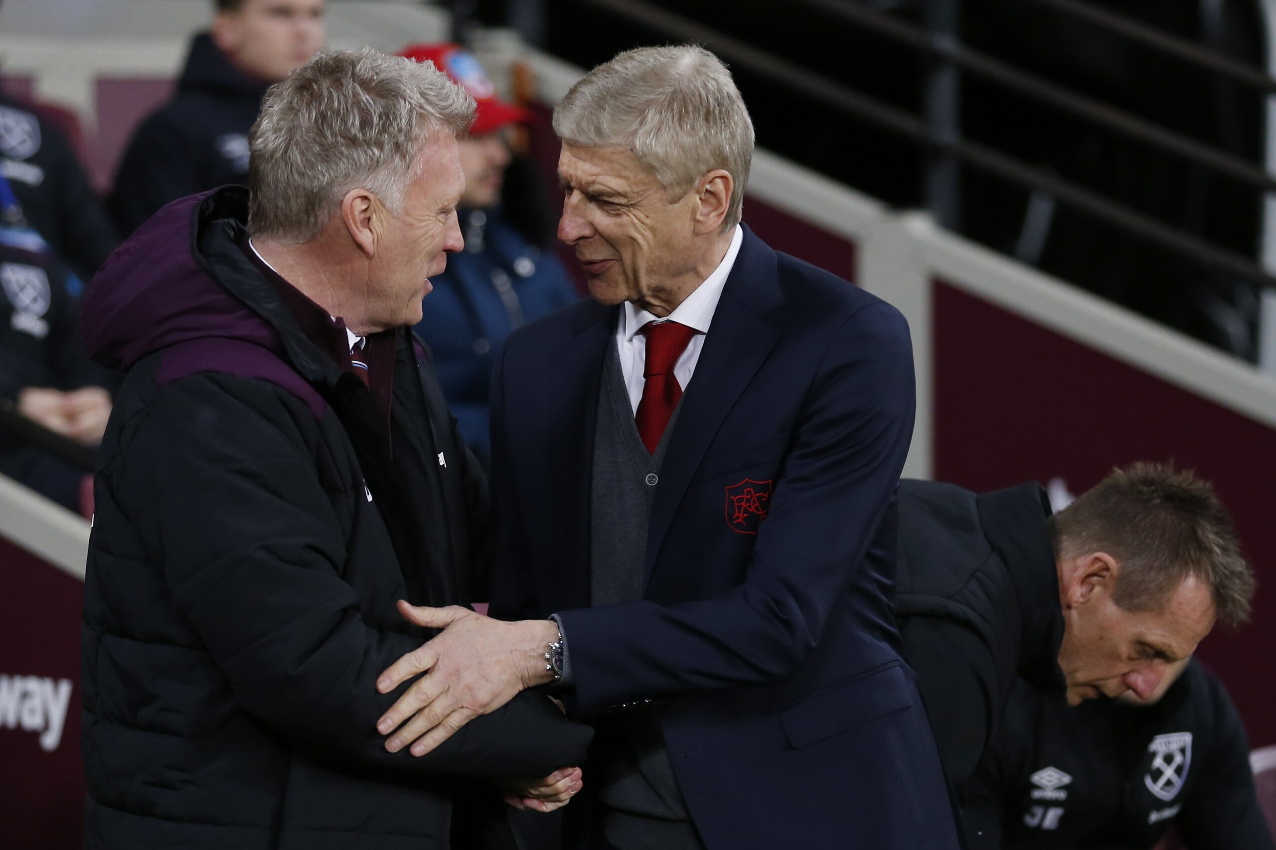 West Ham United's Scottish manager David Moyes (L) greets Arsenal's French manager Arsene Wenger before the English Premier League football match between West Ham United and Arsenal at The London Stadium, in east London on December 13, 2017. / AFP PHOTO /