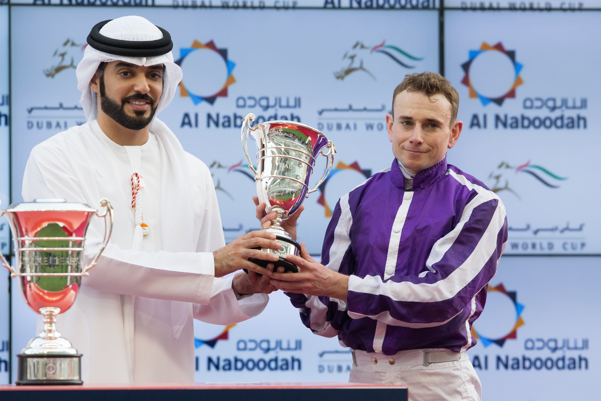 DUBAI, UNITED ARAB EMIRATES - MARCH 31: Ryan Moore receives the trophy after Mendelssohn winning the UAE Derby during the Dubai World Cup Day at Meydan Racecourse on March 31, 2018 in Dubai, United Arab Emirates. DUBAI, UNITED ARAB EMIRATES - MARCH 31: Ryan Moore receives the trophy after Mendelssohn winning the UAE Derby during the Dubai World Cup Day at Meydan Racecourse on March 31, 2018 in Dubai, United Arab Emirates.