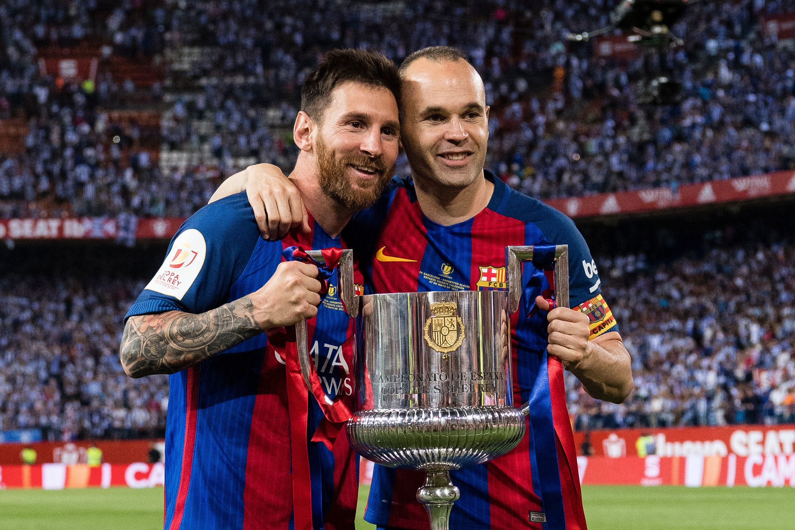 MADRID, SPAIN - MAY 27: Lionel Andres Messi of FC Barcelona (L) and Andres Iniesta Lujan of FC Barcelona (L) poses for photos with the trophy of Copa Del Rey, after the final between FC Barcelona and Deportivo Alaves at Vicente Calderon Stadium on May 27, MADRID, SPAIN - MAY 27: Lionel Andres Messi of FC Barcelona (L) and Andres Iniesta Lujan of FC Barcelona (L) poses for photos with the trophy of Copa Del Rey, after the final between FC Barcelona and Deportivo Alaves at Vicente Calderon Stadium on May 27,