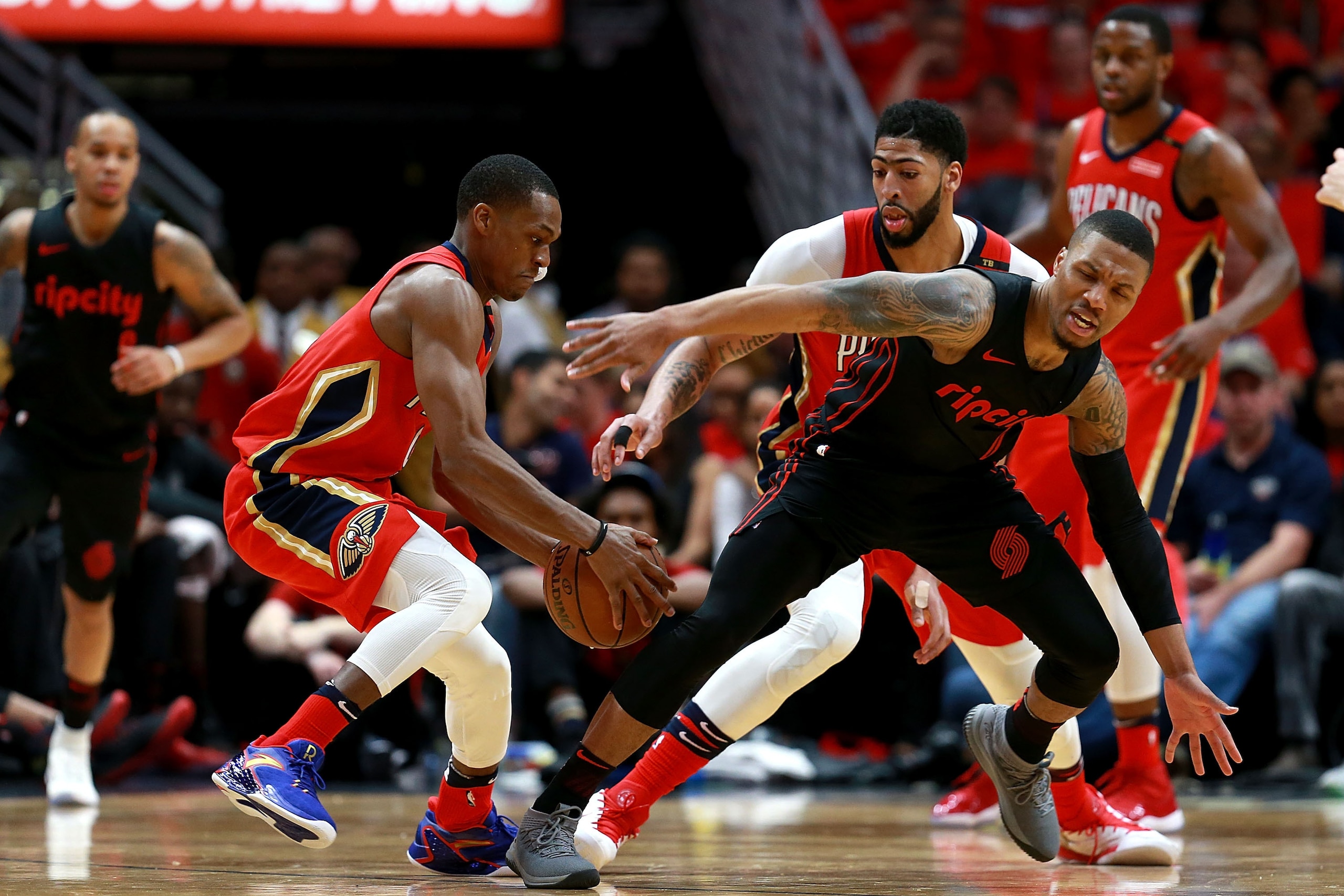 NEW ORLEANS, LA - APRIL 19: Damian Lillard #0 of the Portland Trail Blazers is fouled by Rajon Rondo #9 of the New Orleans Pelicans during Game 3 of the Western Conference playoffs against the Portland Trail Blazers at the Smoothie King Center on April 1 NEW ORLEANS, LA - APRIL 19: Damian Lillard #0 of the Portland Trail Blazers is fouled by Rajon Rondo #9 of the New Orleans Pelicans during Game 3 of the Western Conference playoffs against the Portland Trail Blazers at the Smoothie King Center on April 1