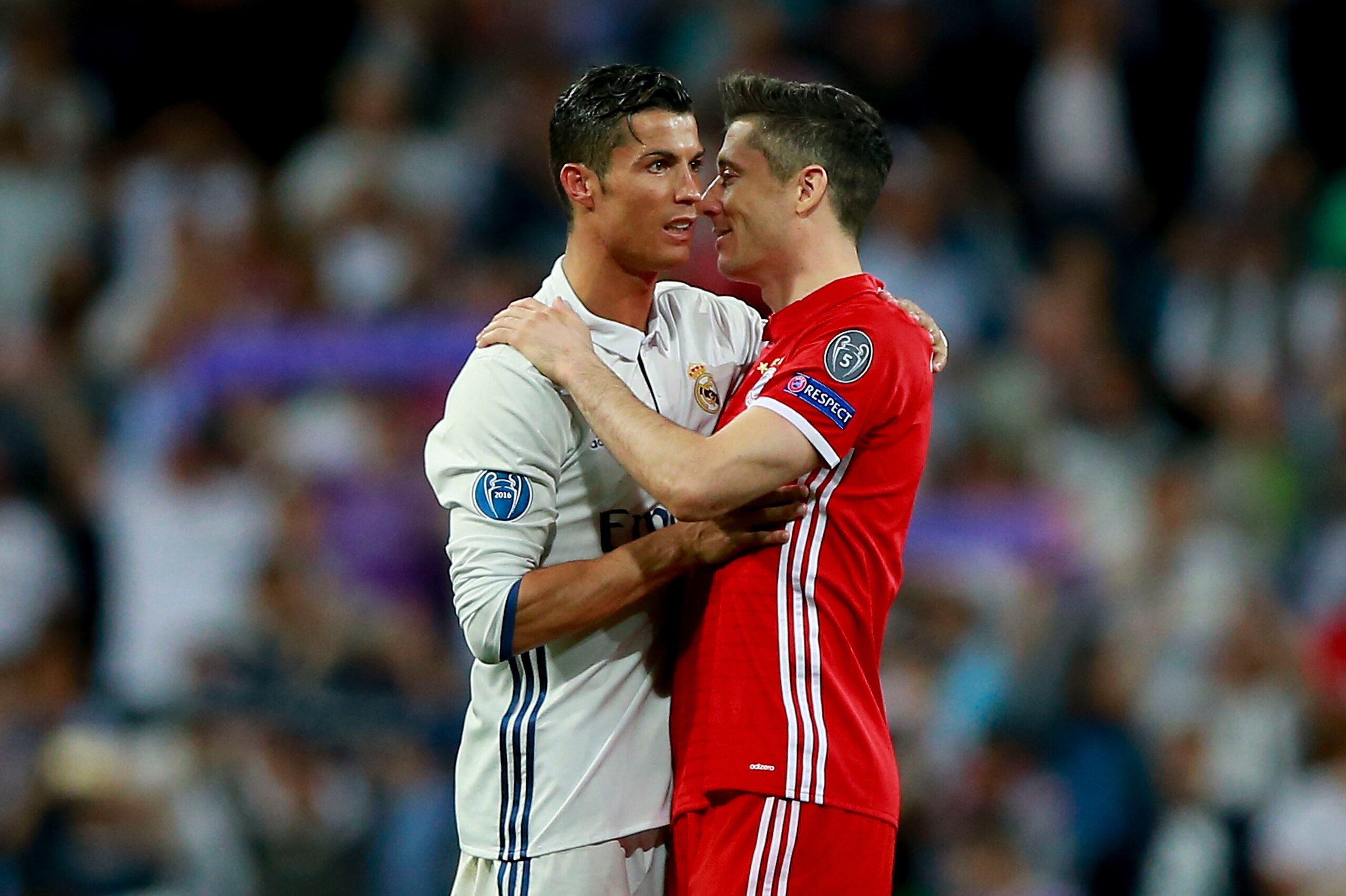 MADRID, SPAIN - APRIL 18:  Cristiano Ronaldo (L) of Real Madrid CF clashes hands with Robert Lewandowski (R) of Bayern Muenchen after the UEFA Champions League Quarter Final second leg match between Real Madrid CF and FC Bayern Muenchen at Estadio Santiag
