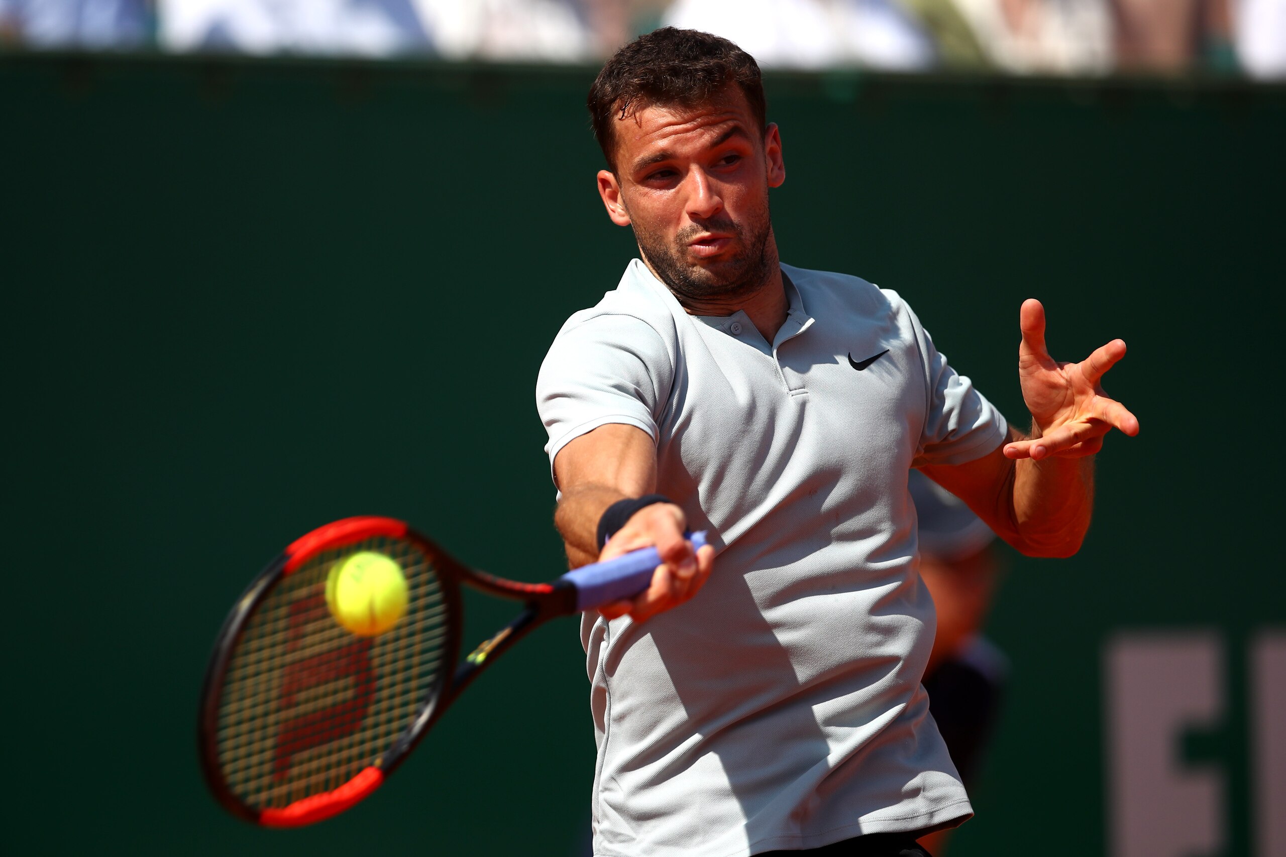 MONTE-CARLO, MONACO - APRIL 21:  Grigor Dimitrov of Bulgaria plays a forehand during his men's Semi-Final match against Rafael Nadal of Spain during day seven of ATP Masters Series: Monte Carlo Rolex Masters at Monte-Carlo Sporting Club on April 21, 2018 