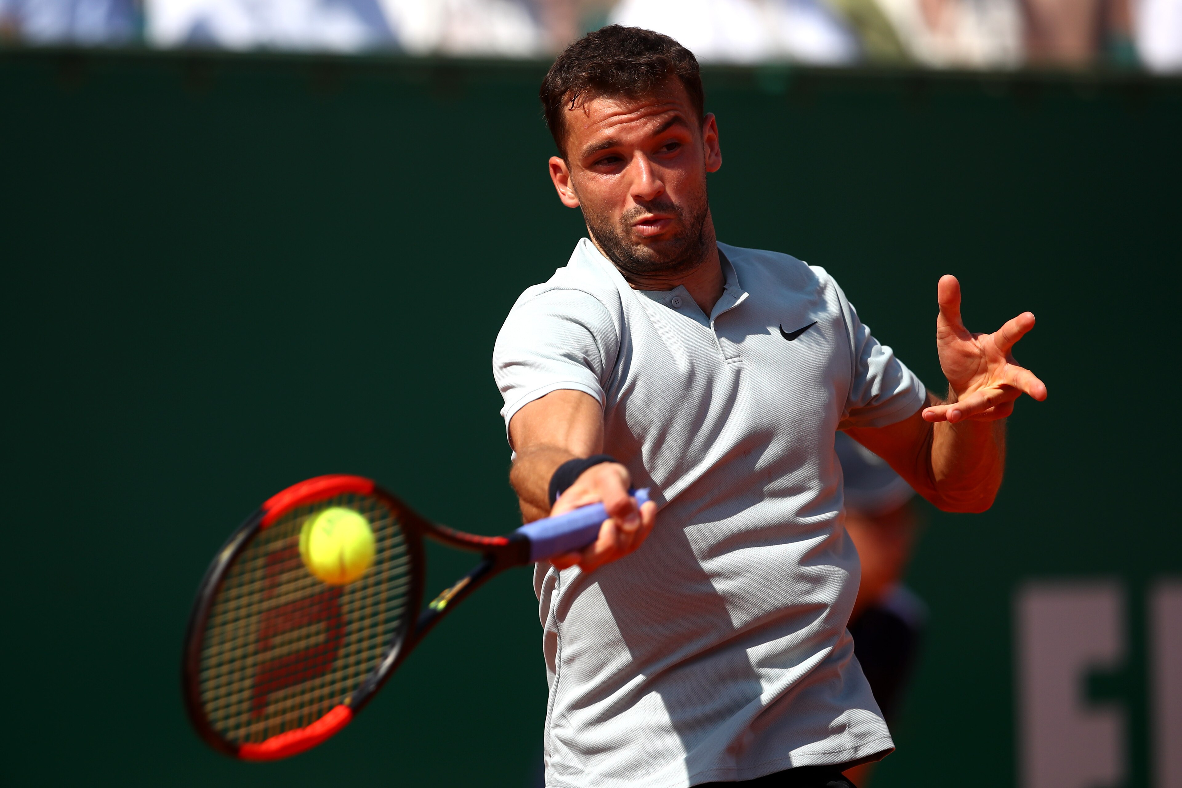 MONTE-CARLO, MONACO - APRIL 21:  Grigor Dimitrov of Bulgaria plays a forehand during his men's Semi-Final match against Rafael Nadal of Spain during day seven of ATP Masters Series: Monte Carlo Rolex Masters at Monte-Carlo Sporting Club on April 21, 2018 