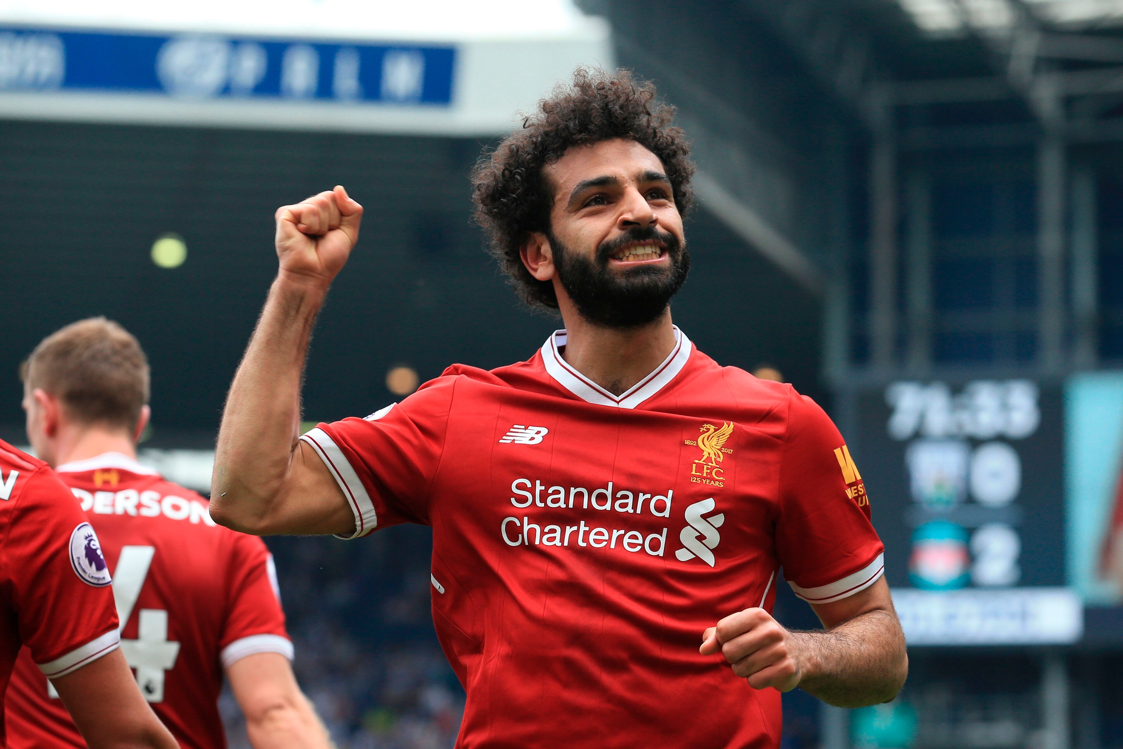 Liverpool's Egyptian midfielder Mohamed Salah celebrates scoring their second goal during the English Premier League football match between West Bromwich Albion and Liverpool at The Hawthorns stadium in West Bromwich, central England, on April 21, 2018. (