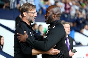 WEST BROMWICH, ENGLAND - APRIL 21:  Darren Moore, Caretaker Manager of West Bromwich Albion greets Jurgen Klopp, Manager of Liverpool prior to the Premier League match between West Bromwich Albion and Liverpool at The Hawthorns on April 21, 2018 in West B