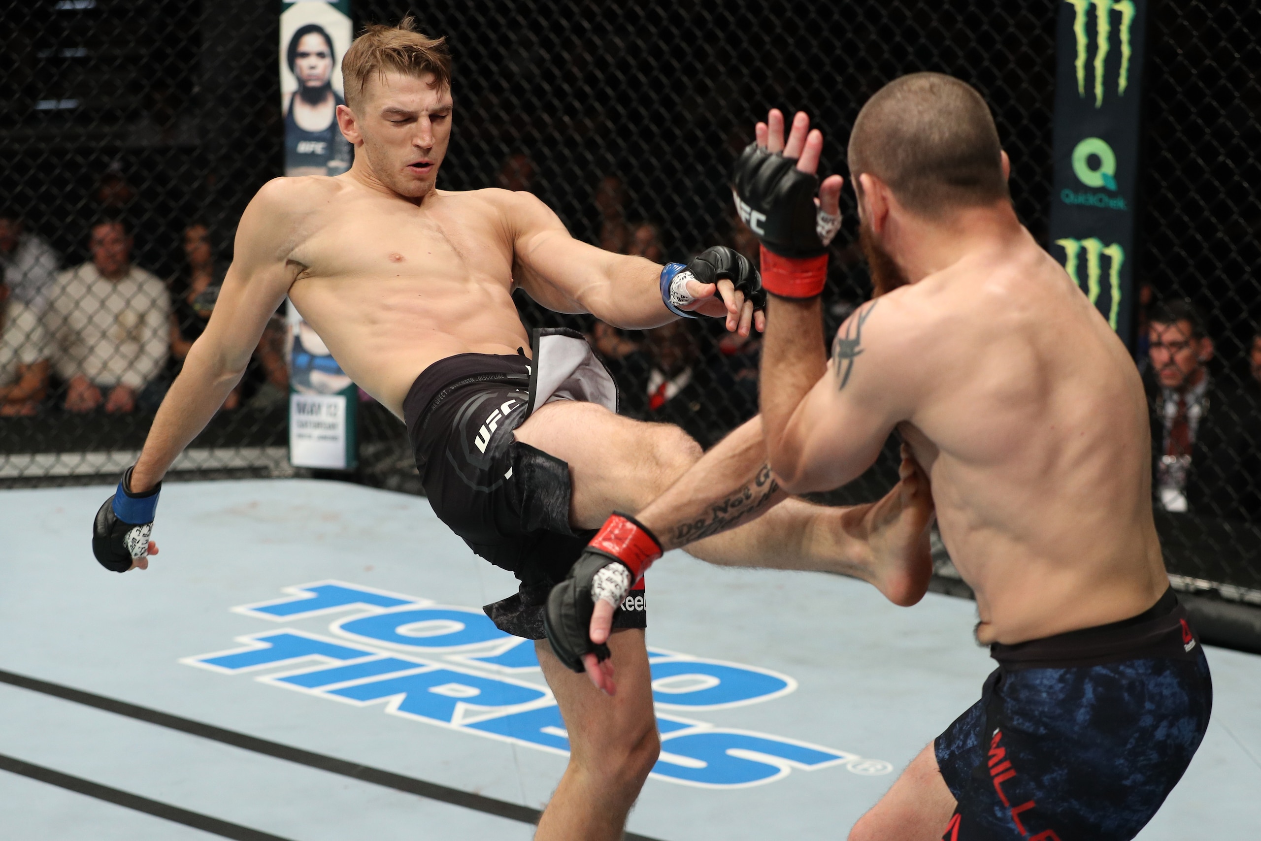 ATLANTIC CITY, NJ - APRIL 21:  (L-R) Dan Hooker of New Zealand kicks Jim Miller in their lightweight fight during the UFC Fight Night event at the Boardwalk Hall on April 21, 2018 in Atlantic City, New Jersey. (Photo by Patrick Smith/Zuffa LLC/Zuffa LLC v