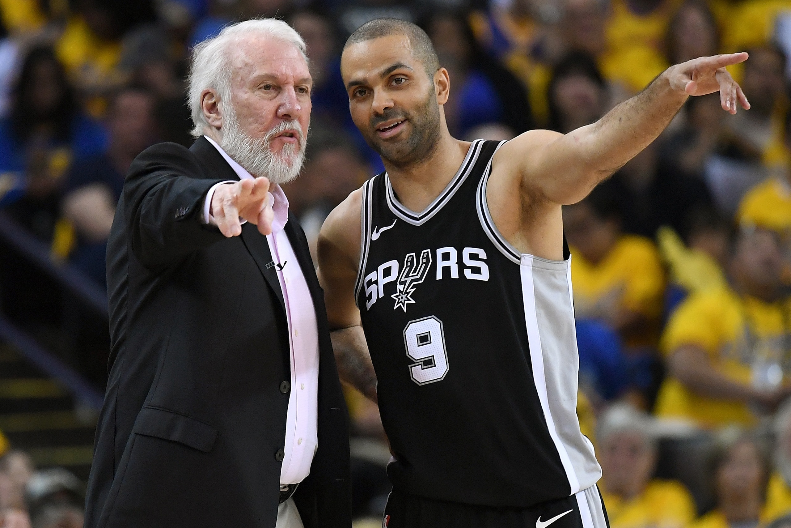 OAKLAND, CA - APRIL 14:  Head coach Gregg Popovich of the San Antonio Spurs talks with his player Tony Parker #9 against the Golden State Warriors in the second quarter during Game One of the first round of the 2018 NBA Playoff at ORACLE Arena on April 14
