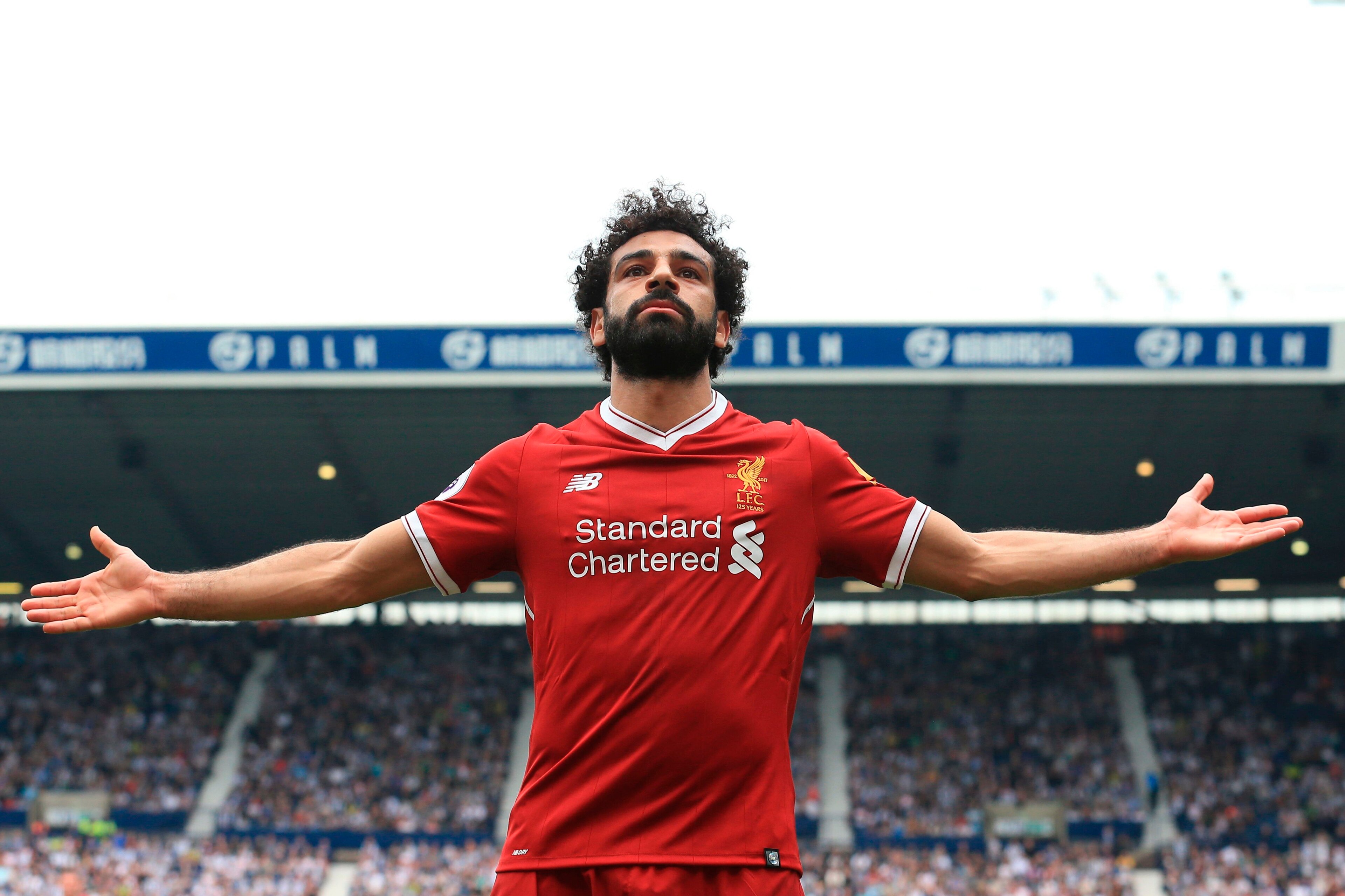 Liverpool's Egyptian midfielder Mohamed Salah celebrates scoring their second goal during the English Premier League football match between West Bromwich Albion and Liverpool at The Hawthorns stadium in West Bromwich, central England, on April 21, 2018. (