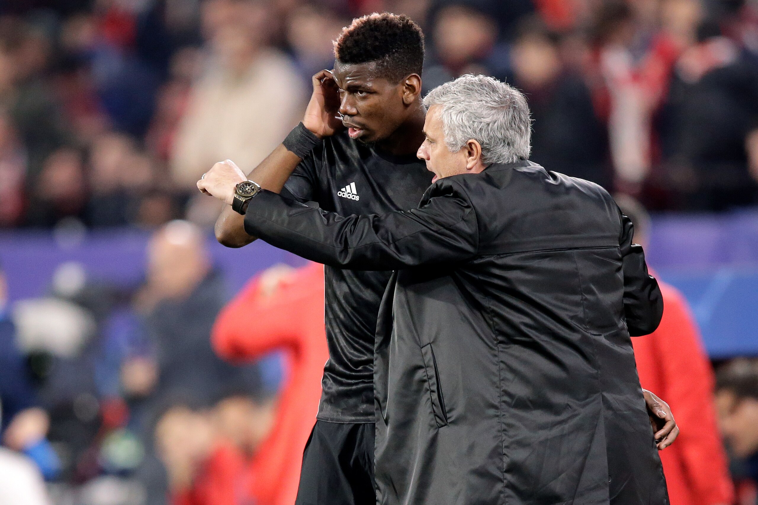 SEVILLA, SPAIN - FEBRUARY 21: (L-R) Paul Pogba of Manchester United, coach Jose Mourinho of Manchester United  during the UEFA Champions League  match between Sevilla v Manchester United at the Estadio Ramon Sanchez Pizjuan on February 21, 2018 in Sevilla