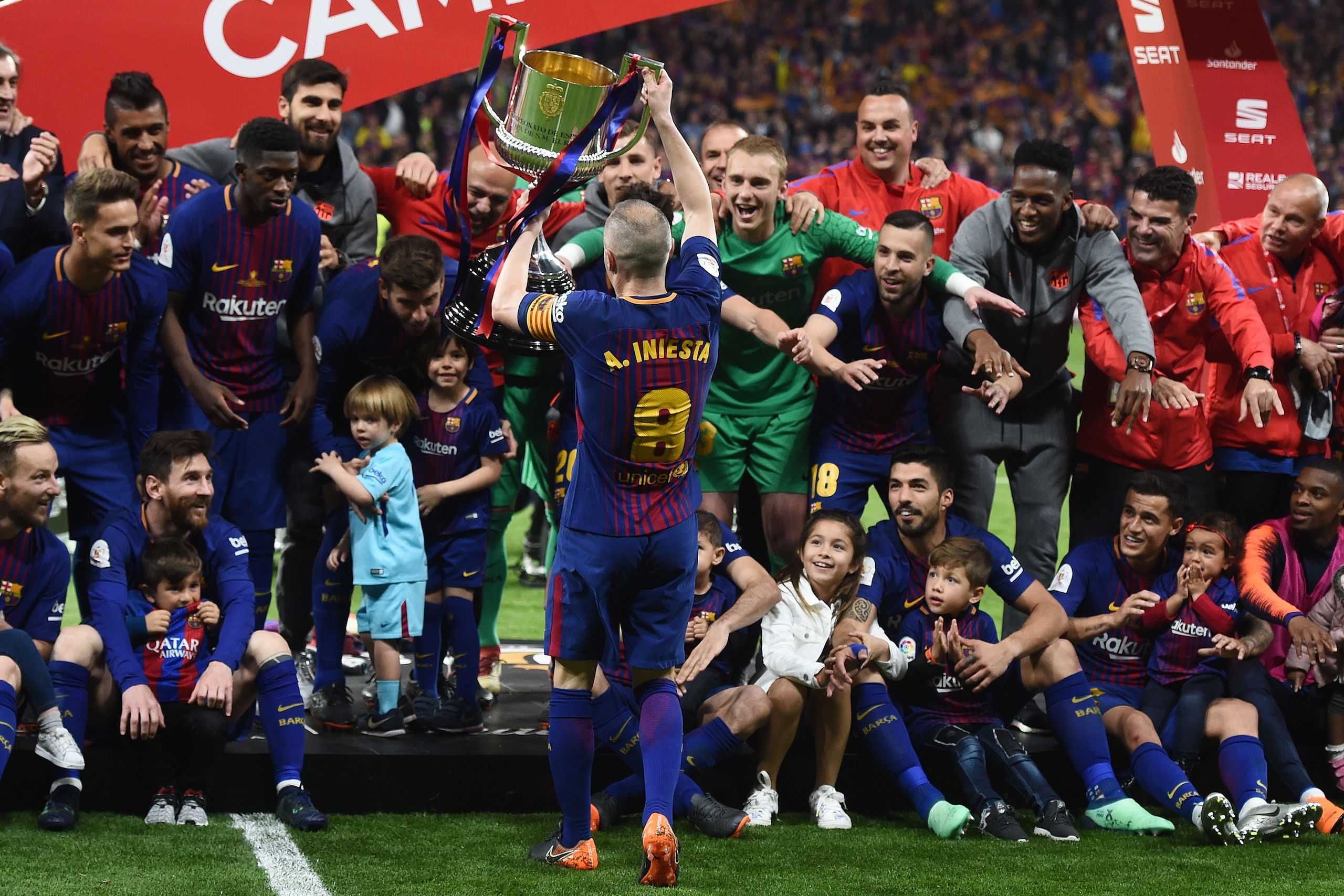 MADRID, SPAIN - APRIL 21: Andres Iniesta of FC Barcelona shows the trophy to teammates and their children after beating Sevilla 5-0 in the Spanish Copa del Rey Final match between Barcelona and Sevilla at Wanda Metropolitano stadium on April 21, 2018 in M