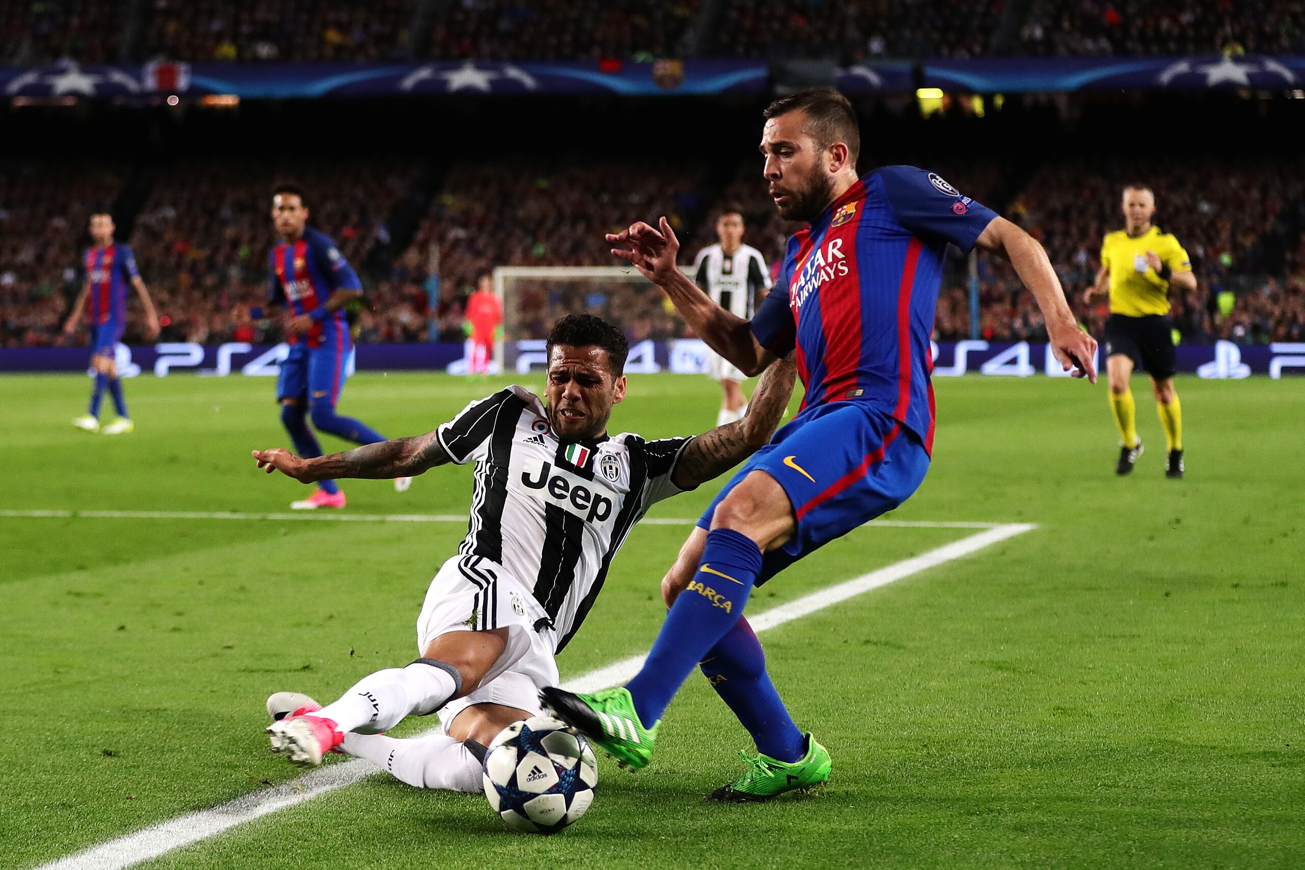 BARCELONA, SPAIN - APRIL 19: Jordi Alba of FC Barcelona is tackled by Dani Alves of Juventus during the UEFA Champions League Quarter Final second leg match between FC Barcelona and Juventus at Camp Nou on April 19, 2017 in Barcelona, Spain.  (Photo by Ch