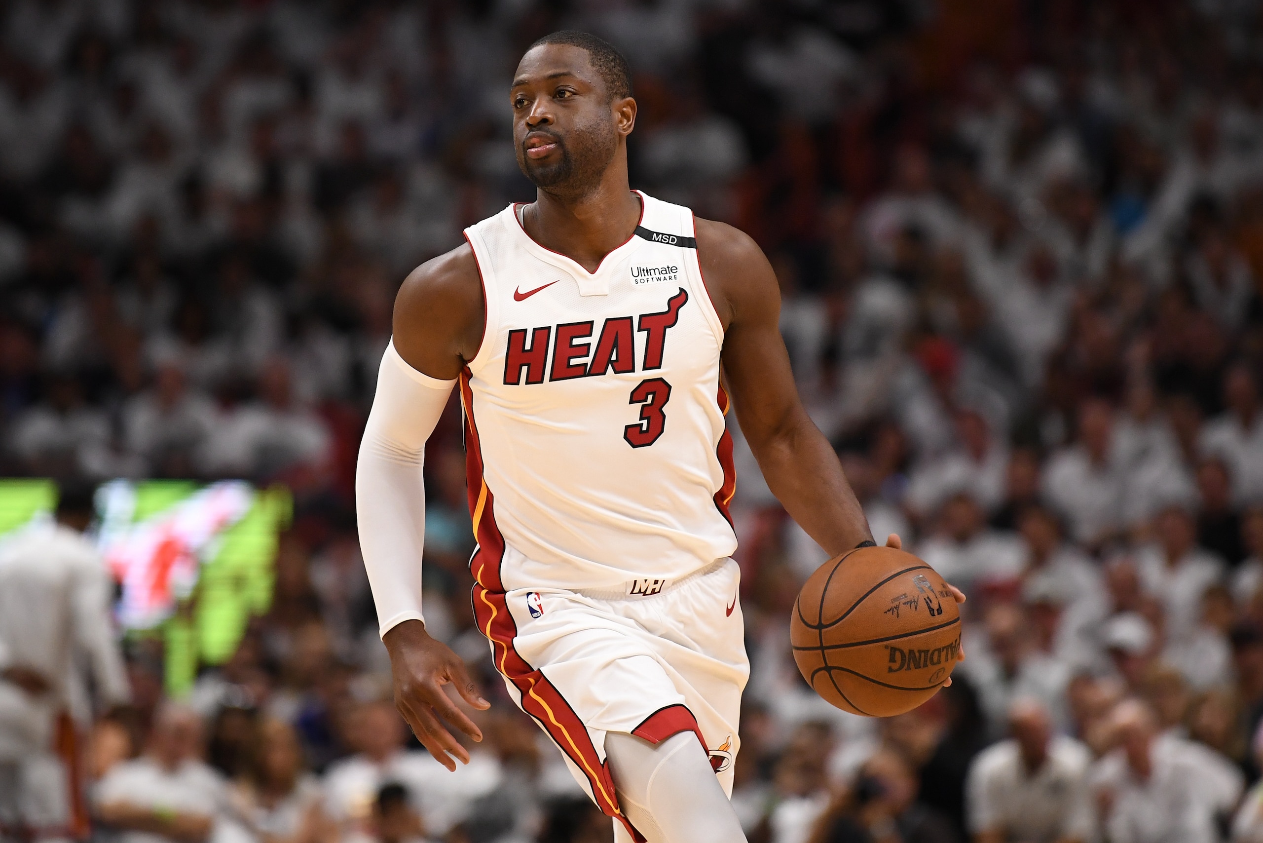 MIAMI, FL - APRIL 21: Dwyane Wade #3 of the Miami Heat brings the ball up the court in the third quarter against the Philadelphia 76ers during Game Four of Round One of the 2018 NBA Playoffs at American Airlines Arena on April 21, 2018 in Miami, Florida. 