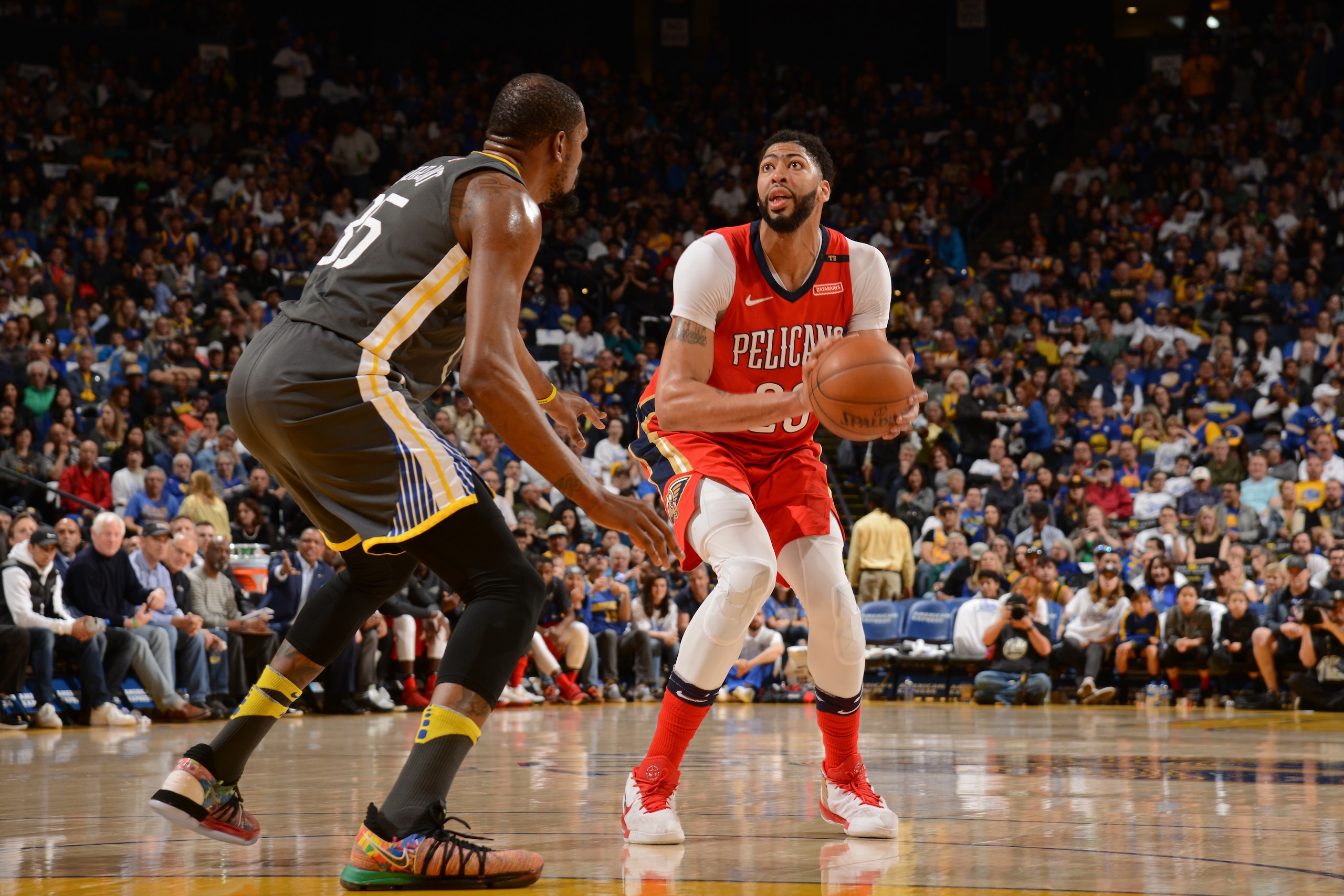 OAKLAND, CA - APRIL 7: Anthony Davis #23 of the New Orleans Pelicans prepares to shoot the ball against Kevin Durant #35 of the Golden State Warriors on April 7, 2018 at ORACLE Arena in Oakland, California. NOTE TO USER: User expressly acknowledges and a OAKLAND, CA - APRIL 7: Anthony Davis #23 of the New Orleans Pelicans prepares to shoot the ball against Kevin Durant #35 of the Golden State Warriors on April 7, 2018 at ORACLE Arena in Oakland, California. NOTE TO USER: User expressly acknowledges and a