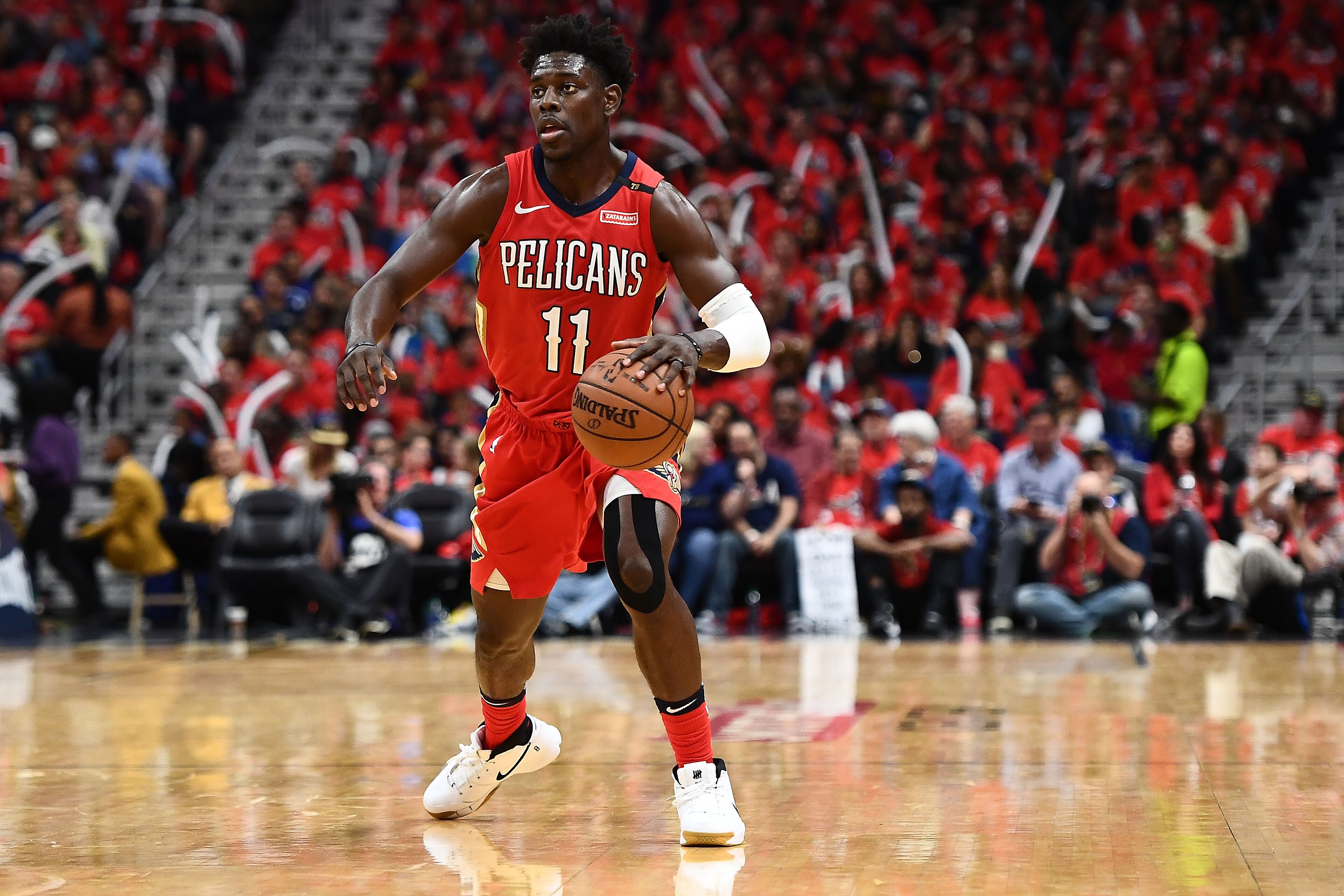 NEW ORLEANS, LA - APRIL 21:  Jrue Holiday #11 of the New Orleans Pelicans handles the ball against the Portland Trail Blazers during Game Four of the first round of the Western Conference playoffs at the Smoothie King Center on April 21, 2018 in New Orlea