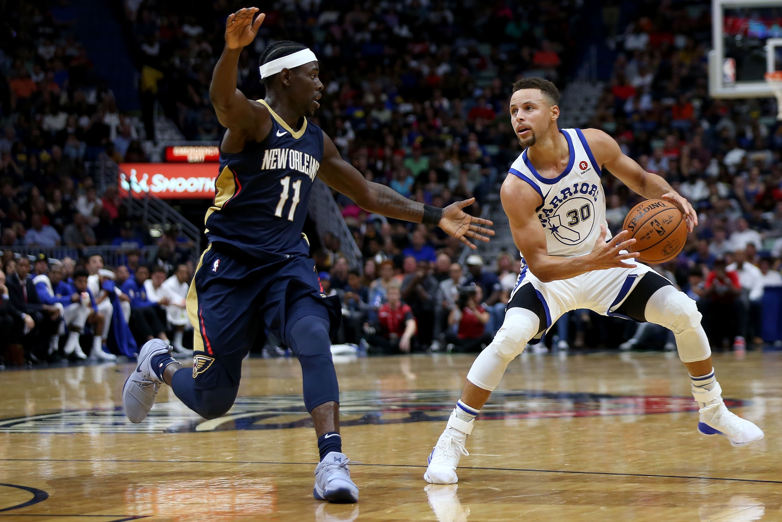 NEW ORLEANS, LA - OCTOBER 20: Stephen Curry #30 of the Golden State Warriors drives to the goal past Jrue Holiday #11 of the New Orleans Pelicans during a game at Smoothie King Center on October 20, 2017 in New Orleans, Louisiana. NOTE TO USER: User exp NEW ORLEANS, LA - OCTOBER 20: Stephen Curry #30 of the Golden State Warriors drives to the goal past Jrue Holiday #11 of the New Orleans Pelicans during a game at Smoothie King Center on October 20, 2017 in New Orleans, Louisiana. NOTE TO USER: User exp