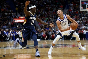 NEW ORLEANS, LA - OCTOBER 20: Stephen Curry #30 of the Golden State Warriors drives to the goal past Jrue Holiday #11 of the New Orleans Pelicans during a game at Smoothie King Center on October 20, 2017 in New Orleans, Louisiana. NOTE TO USER: User exp NEW ORLEANS, LA - OCTOBER 20: Stephen Curry #30 of the Golden State Warriors drives to the goal past Jrue Holiday #11 of the New Orleans Pelicans during a game at Smoothie King Center on October 20, 2017 in New Orleans, Louisiana. NOTE TO USER: User exp