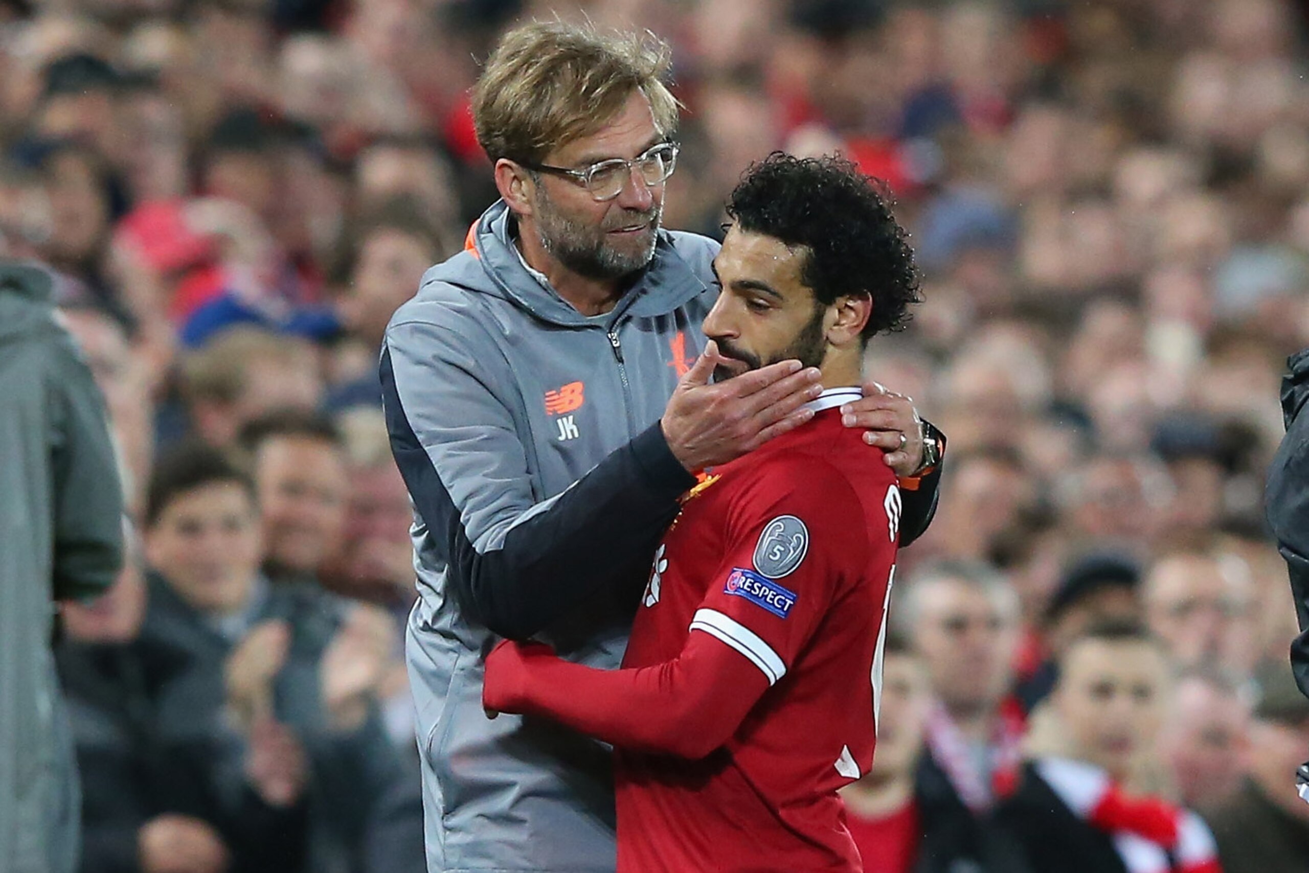LIVERPOOL, ENGLAND - APRIL 24:  Jurgen Klopp the manager of Liverpool congratulates Mohamed Salah after substituting him during the UEFA Champions League Semi Final First Leg match between Liverpool and A.S. Roma at Anfield on April 24, 2018 in Liverpool,