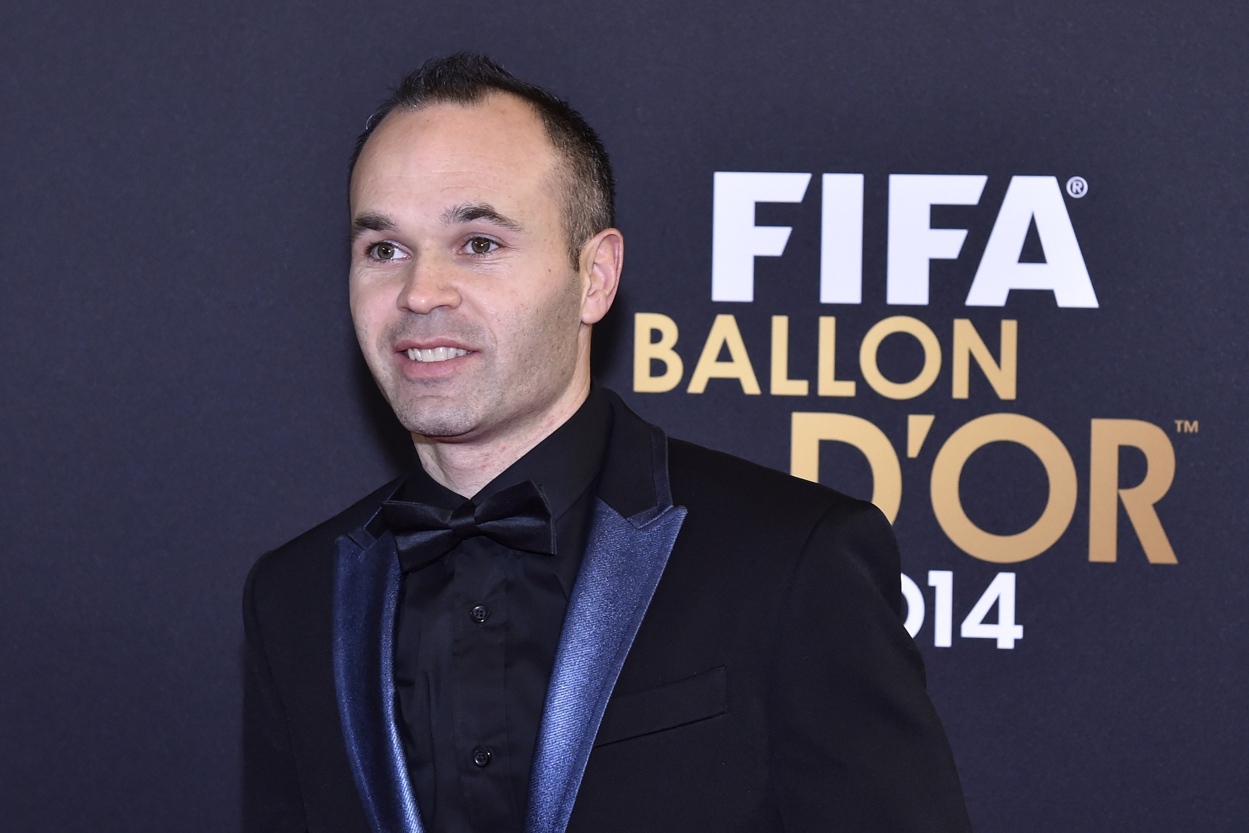 FC Barcelona's Andres Iniesta from Spain poses during the red carpet ceremony ahead of the 2014 FIFA Ballon d'Or award ceremony at the Kongresshaus in Zurich on January 12, 2015. AFP PHOTO / MICHAEL BUHOLZER        (Photo credit should read MICHAEL BUHOLZ