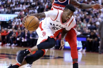 TORONTO, ON - APRIL 25:  Delon Wright #55 of the Toronto Raptors dribbles the ball as Ty Lawson #4 of the Washington Wizards defends during the second half of Game Five in Round One of the 2018 NBA playoffs at Air Canada Centre on April 25, 2018 in Toront