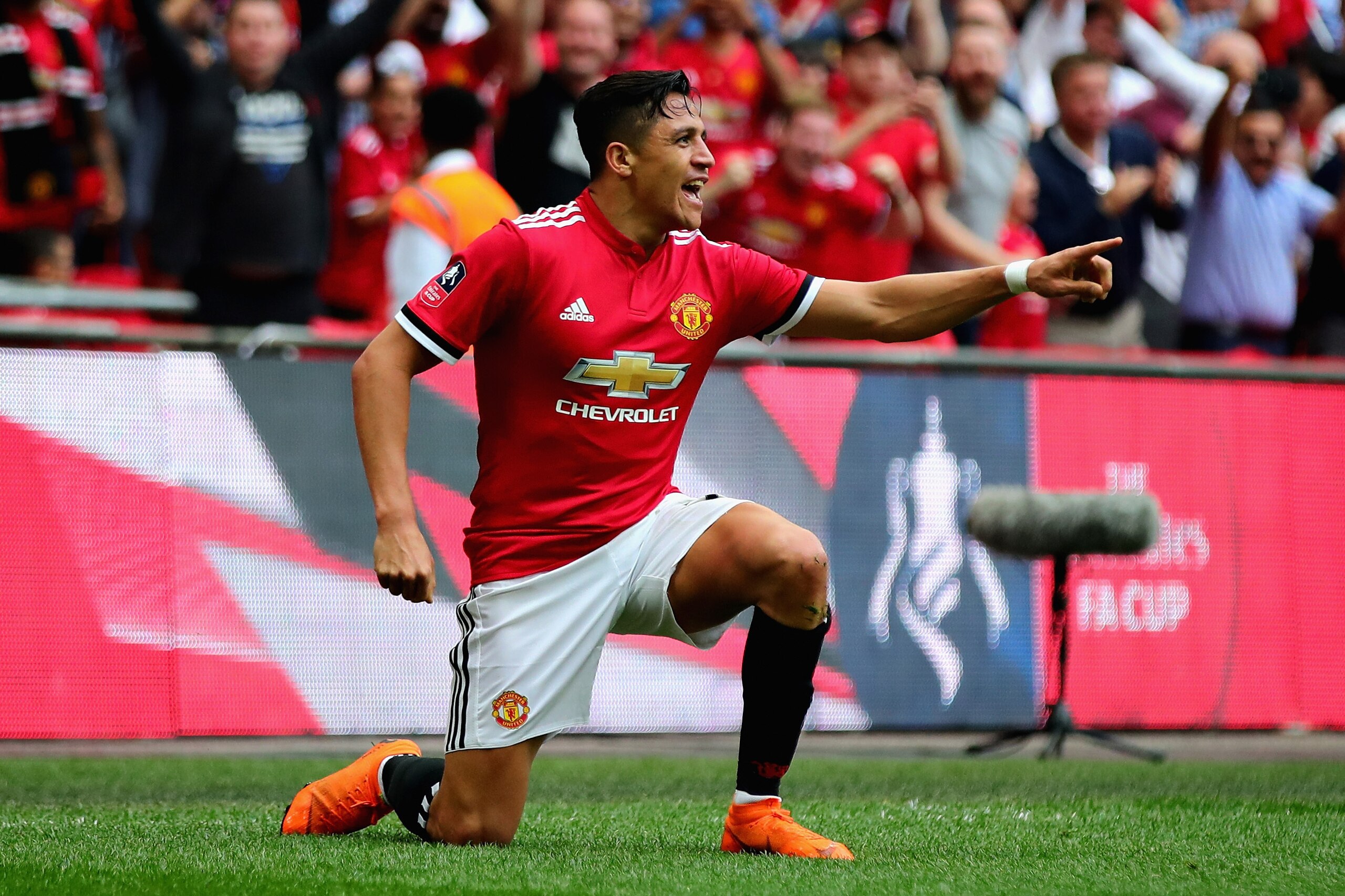 LONDON, ENGLAND - APRIL 21:  Alexis Sanchez of Manchester United celebrates after scoring his sides first goal during The Emirates FA Cup Semi Final match between Manchester United and Tottenham Hotspur at Wembley Stadium on April 21, 2018 in London, Engl