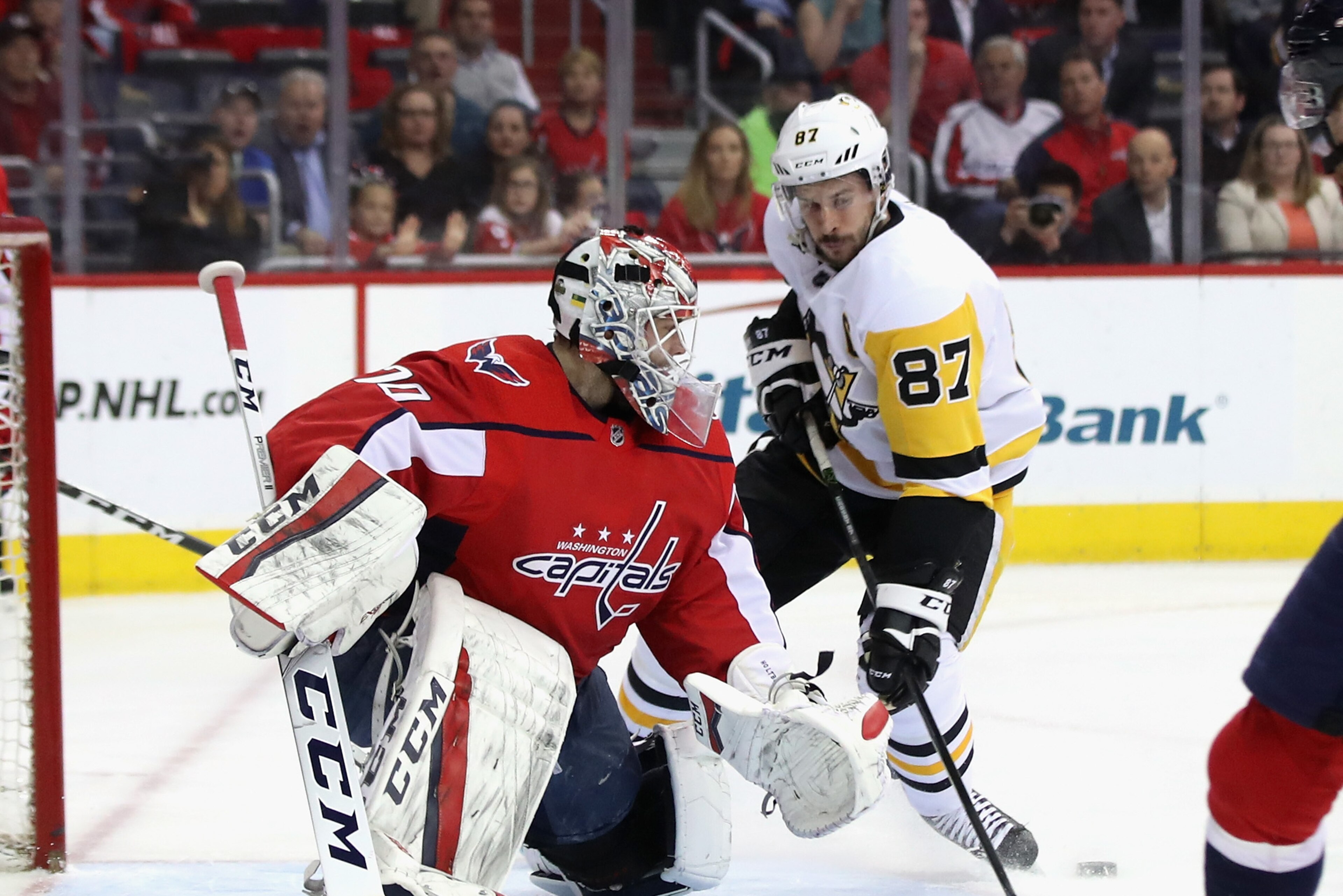 WASHINGTON, DC - APRIL 26:  Braden Holtby #70 of the Washington Capitals makes the first period save on Sidney Crosby #87 of the Pittsburgh Penguins in Game One of the Eastern Conference Second Round during the 2018 NHL Stanley Cup Playoffs at the Capital