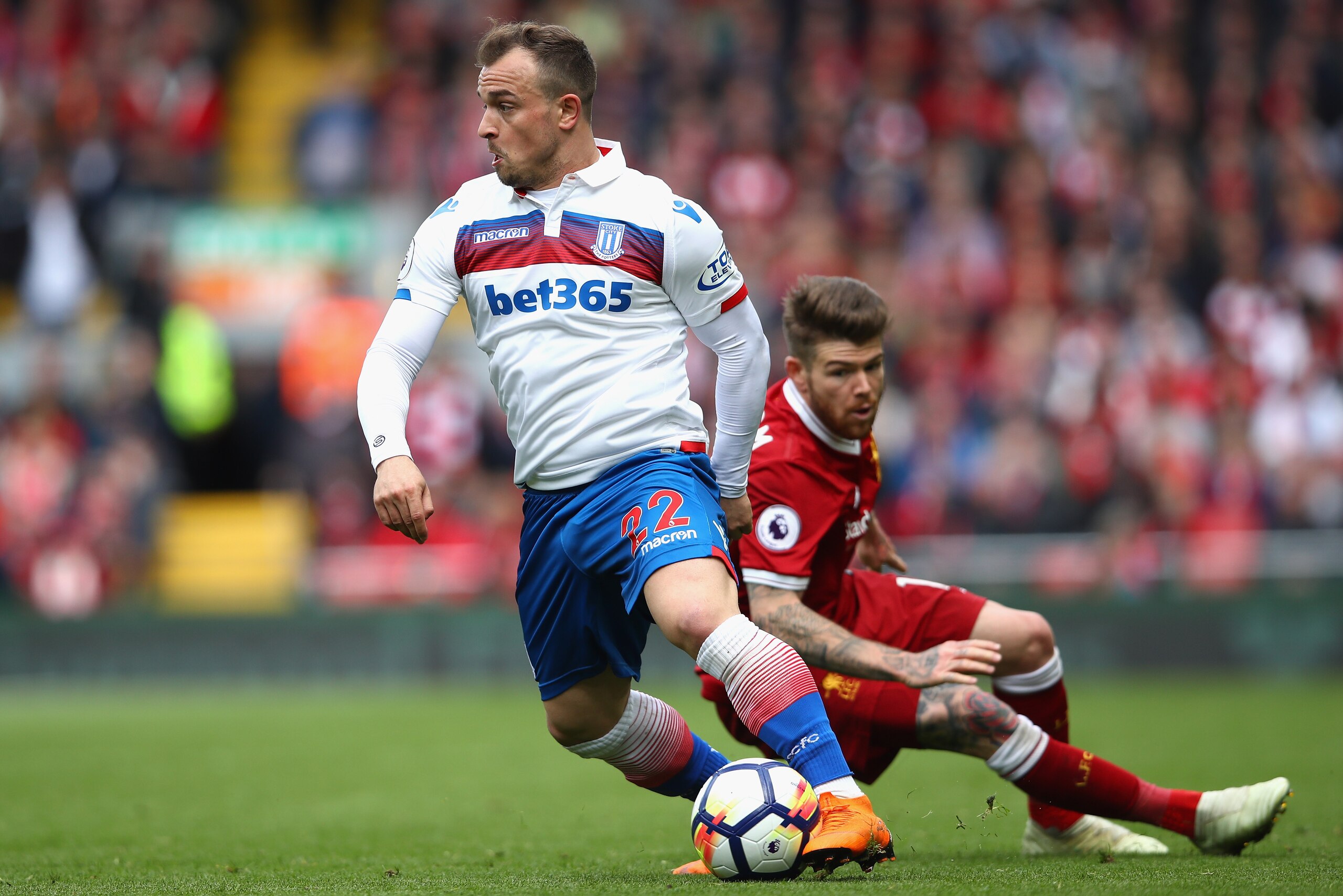 LIVERPOOL, ENGLAND - APRIL 28:  Xherdan Shaqiri of Stoke City turns Alberto Moreno of Liverpool during the Premier League match between Liverpool and Stoke City at Anfield on April 28, 2018 in Liverpool, England.  (Photo by Clive Brunskill/Getty Images)