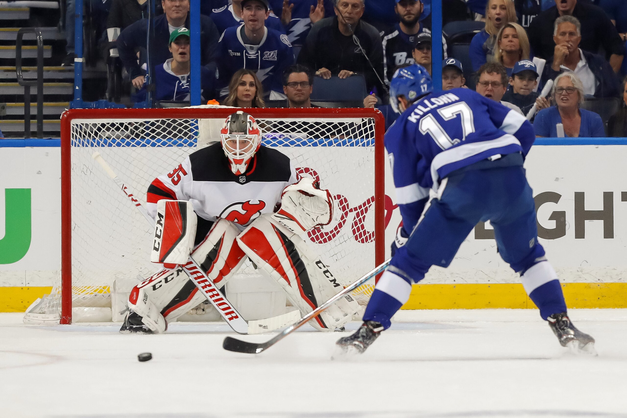 TAMPA, FL - APRIL 21: Cory Schneider #35 of the New Jersey Devils looks out as Alex Killorn #17 of the Tampa Bay Lightning approaches in the first period of Game Five of the Eastern Conference First Round during the 2018 NHL Stanley Cup Playoffs at Amalie