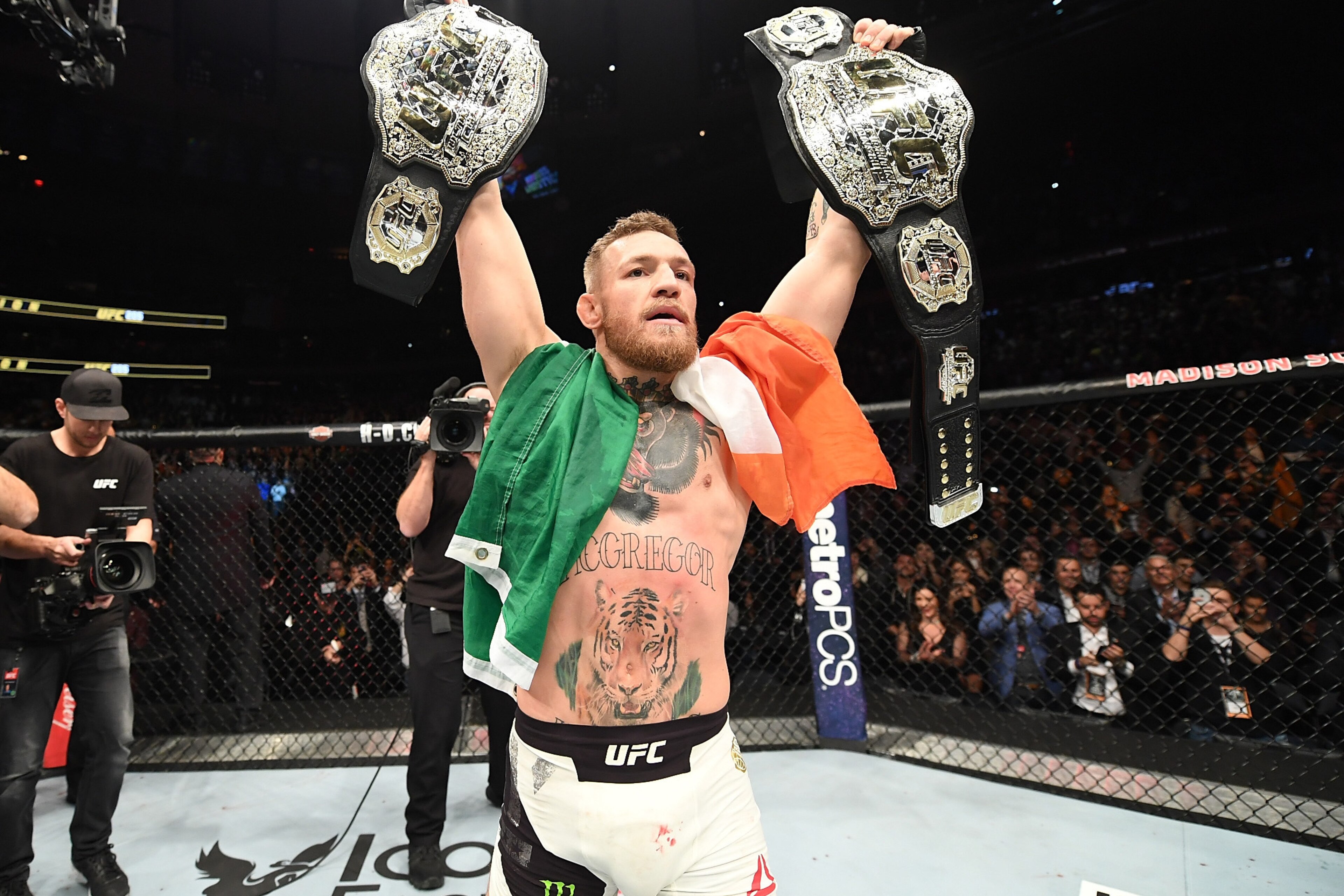 NEW YORK, NY - NOVEMBER 12:  UFC lightweight and featherweight champion Conor McGregor of Ireland celebrates after defeating Eddie Alvarez in their UFC lightweight championship fight during the UFC 205 event at Madison Square Garden on November 12, 2016 i
