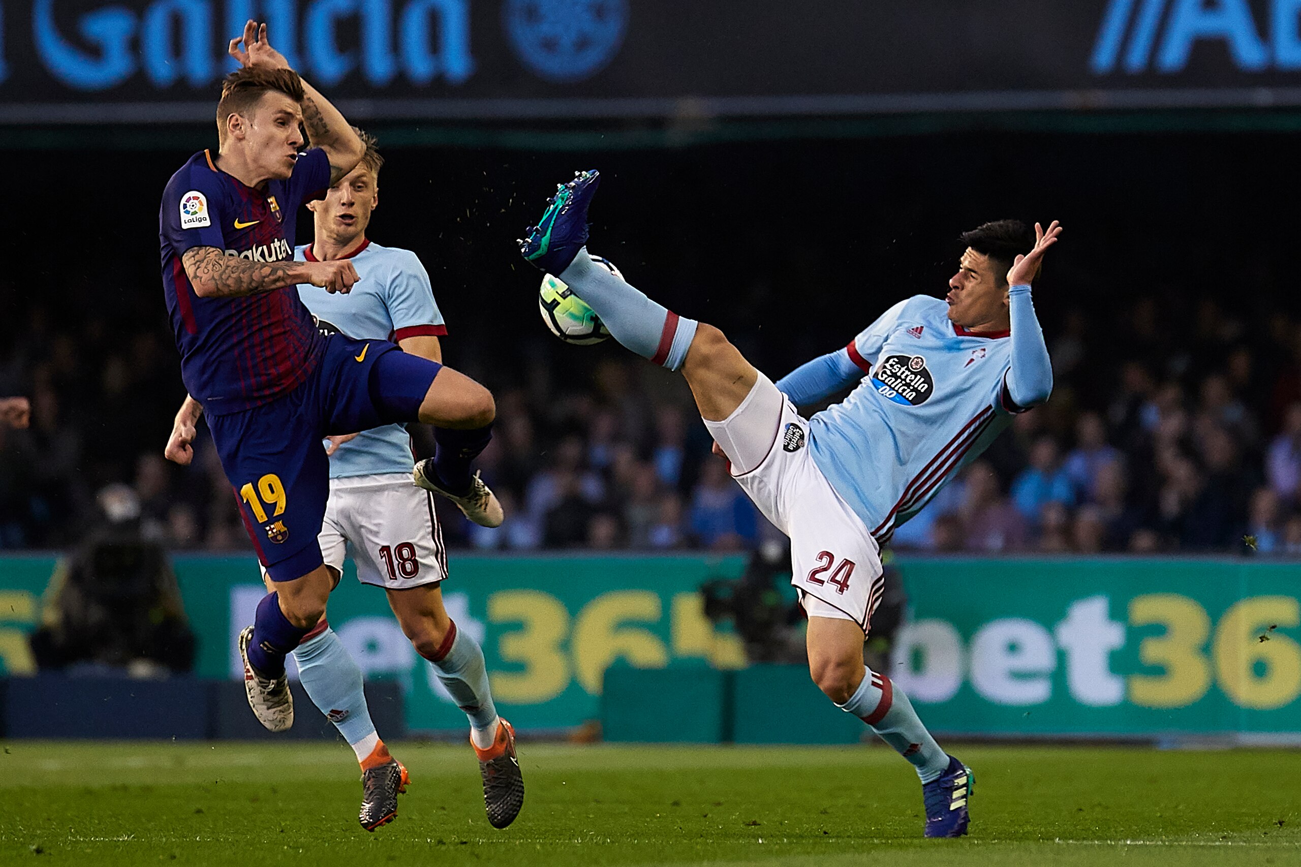 VIGO, SPAIN - APRIL 17:  Facundo Roncaglia of Celta de Vigo competes for the ball with Lucas Digne of FC Barcelona during the La Liga match between Celta de Vigo and Barcelona at Balaidos Stadium on April 17, 2018 in Vigo, Spain.  (Photo by Quality Sport 