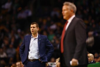 BOSTON, MA - JANUARY 18:  Head coach Brad Stevens of the Boston Celtics and head coach Brett Brown of the Philadelphia 76ers look on during their game at TD Garden on January 18, 2018 in Boston, Massachusetts.  (Photo by Tim Bradbury/Getty Images)