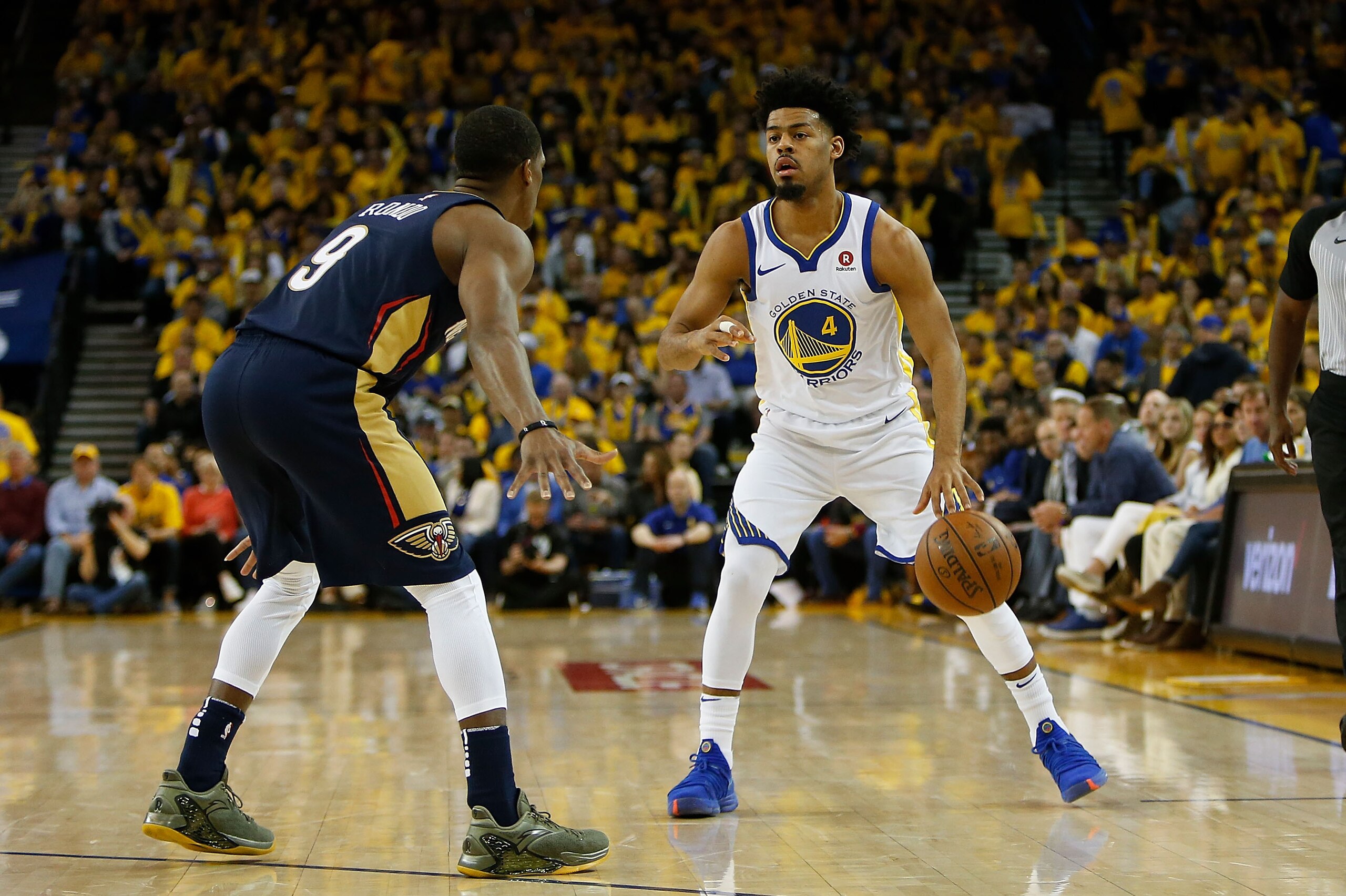 OAKLAND, CA - APRIL 28: Quinn Cook #4 of the Golden State Warriors is guarded by Rajon Rondo #9 of the New Orleans Pelicans during Game One of the Western Conference Semifinals at ORACLE Arena on April 28, 2018 in Oakland, California. NOTE TO USER: User e