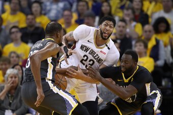 OAKLAND, CA - MAY 01:  Anthony Davis #23 of the New Orleans Pelicans is covered by Draymond Green #23 and Kevin Durant #35 of the Golden State Warriors during Game Two of the Western Conference Semifinals during the 2018 NBA Playoffs at ORACLE Arena on Ma