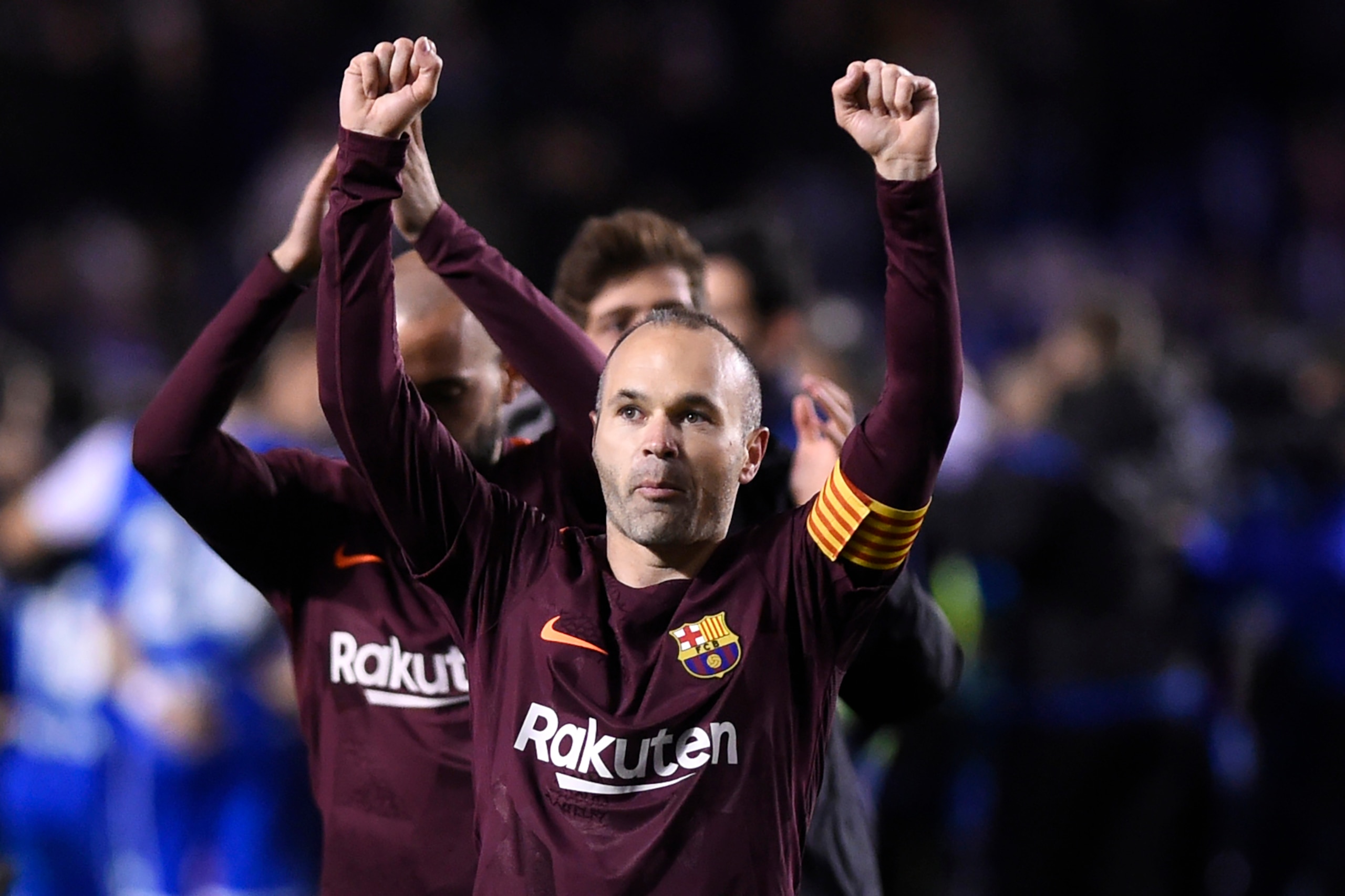 TOPSHOT - Barcelona's Spanish midfielder Andres Iniesta celebrates after his team won the Spanish league football match against Deportivo Coruna and claimed their 25th La Liga at the Riazor stadium in Coruna on April 29, 2018. (Photo by MIGUEL RIOPA / AFP