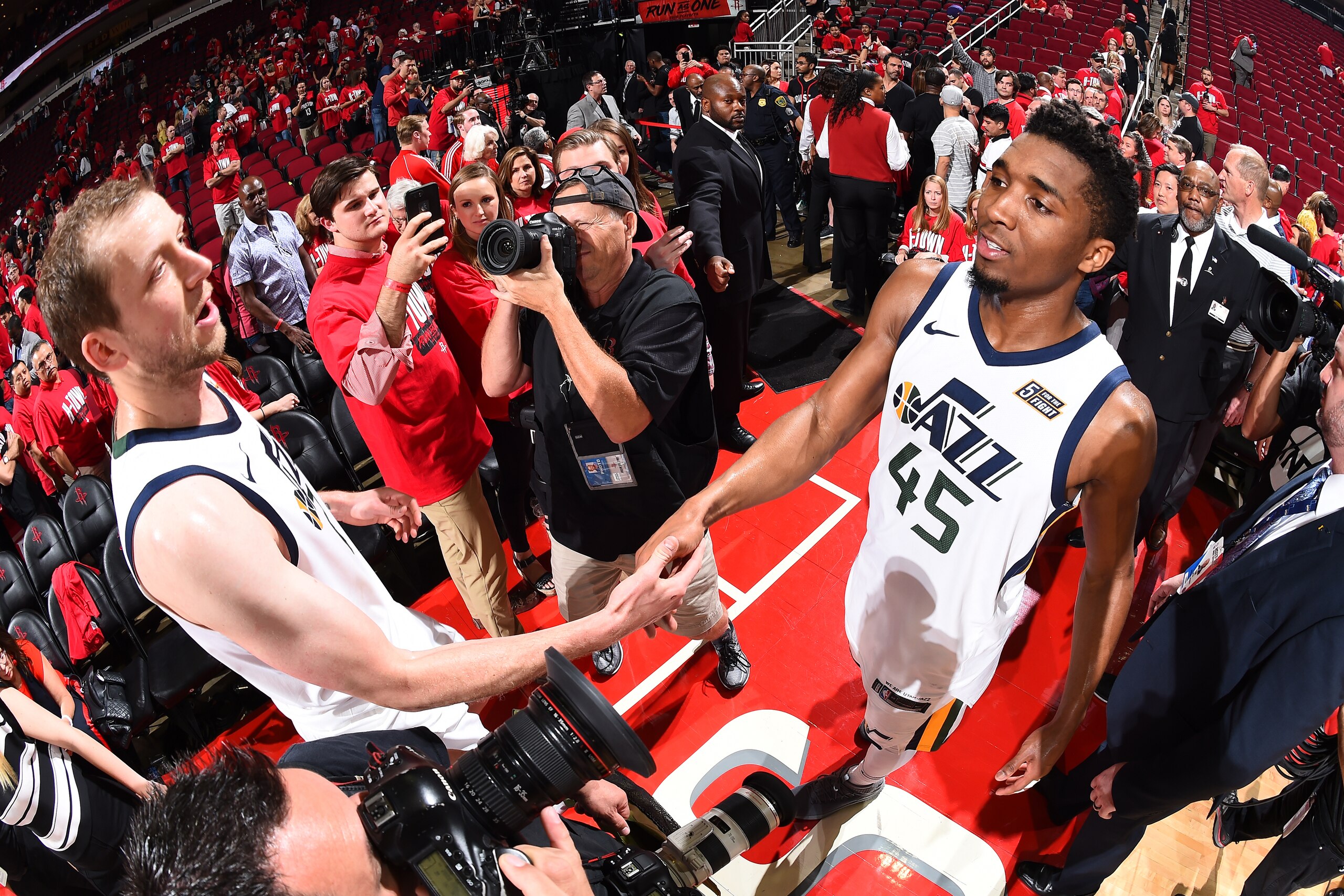 HOUSTON, TX - MAY 2:  Joe Ingles #2 and Donovan Mitchell #45 of the Utah Jazz exchange a handshake after Game Two of Round Two of the 2018 NBA Playoffs against the Houston Rockets on May 2, 2018 at Toyota Center in Houston, TX.  NOTE TO USER: User express