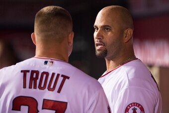 ANAHEIM, CA - MAY 11: Albert Pujols #5 of the Los Angeles Angels of Anaheim talks to Mike Trout #27 in the dugout during the game against the St. Louis Cardinals at Angel Stadium of Anaheim on May 11, 2016 in Anaheim, California. (Photo by Matt Brown/Ange