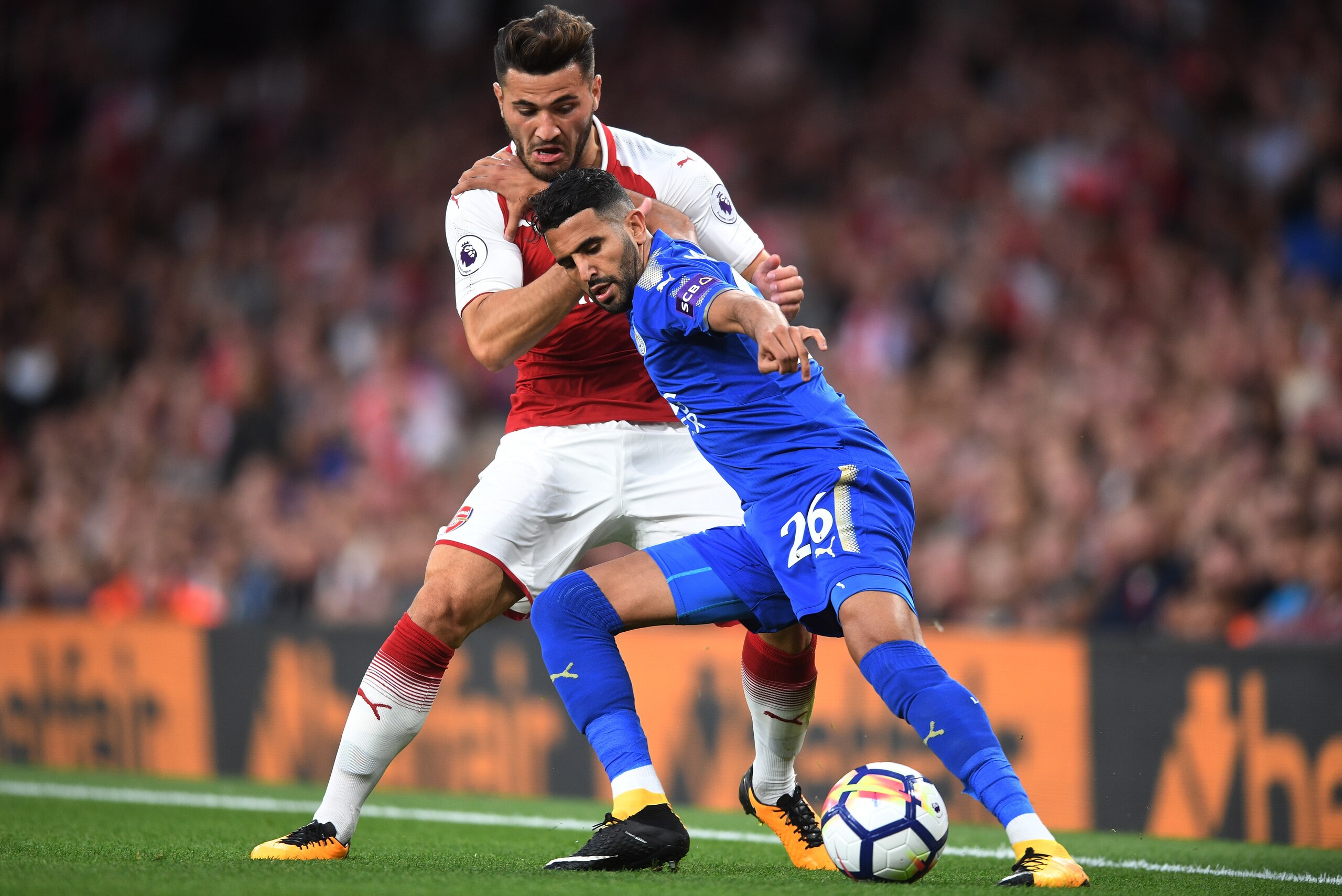 LONDON, ENGLAND - AUGUST 11:  Riyad Mahrez of Leicester City is tackled by Sead Kolasinac of Arsenal during the Premier League match between Arsenal and Leicester City at the Emirates Stadium on August 11, 2017 in London, England.  (Photo by Michael Regan