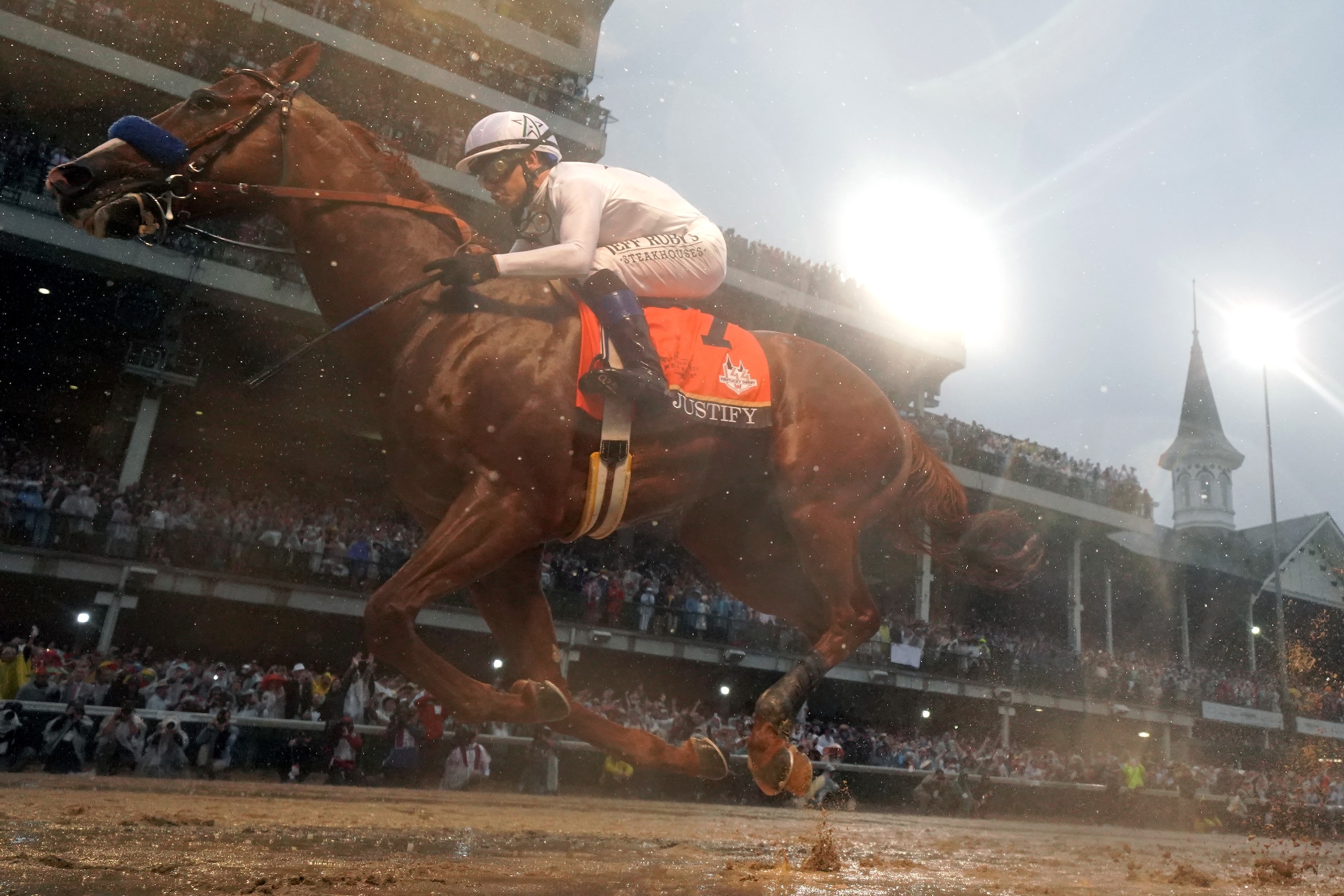 LOUISVILLE, KY - MAY 05:  Justify #7, ridden by jockey Mike Smith crosses the finish line to win the 144th running of the Kentucky Derby at Churchill Downs on May 5, 2018 in Louisville, Kentucky.  (Photo by Rob Carr/Getty Images)