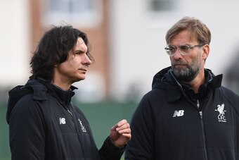 Liverpool's German manager Jurgen Klopp (R) and assistant manager Zeljko Buvac attend a team training session on the eve of the UEFA Champions League first leg quarter-final football match between Liverpool and Manchester City, at Melwood Training Ground 