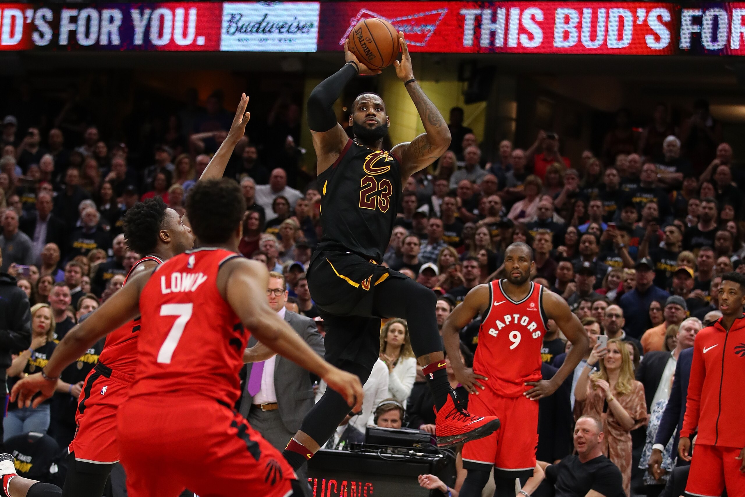 CLEVELAND, OH - MAY 05:  LeBron James #23 of the Cleveland Cavaliers hits the game winning shot over the outstretched hand of OG Anunoby #3 of the Toronto Raptors to win Game Three of the Eastern Conference Semifinals 105-103 during the 2018 NBA Playoffs 