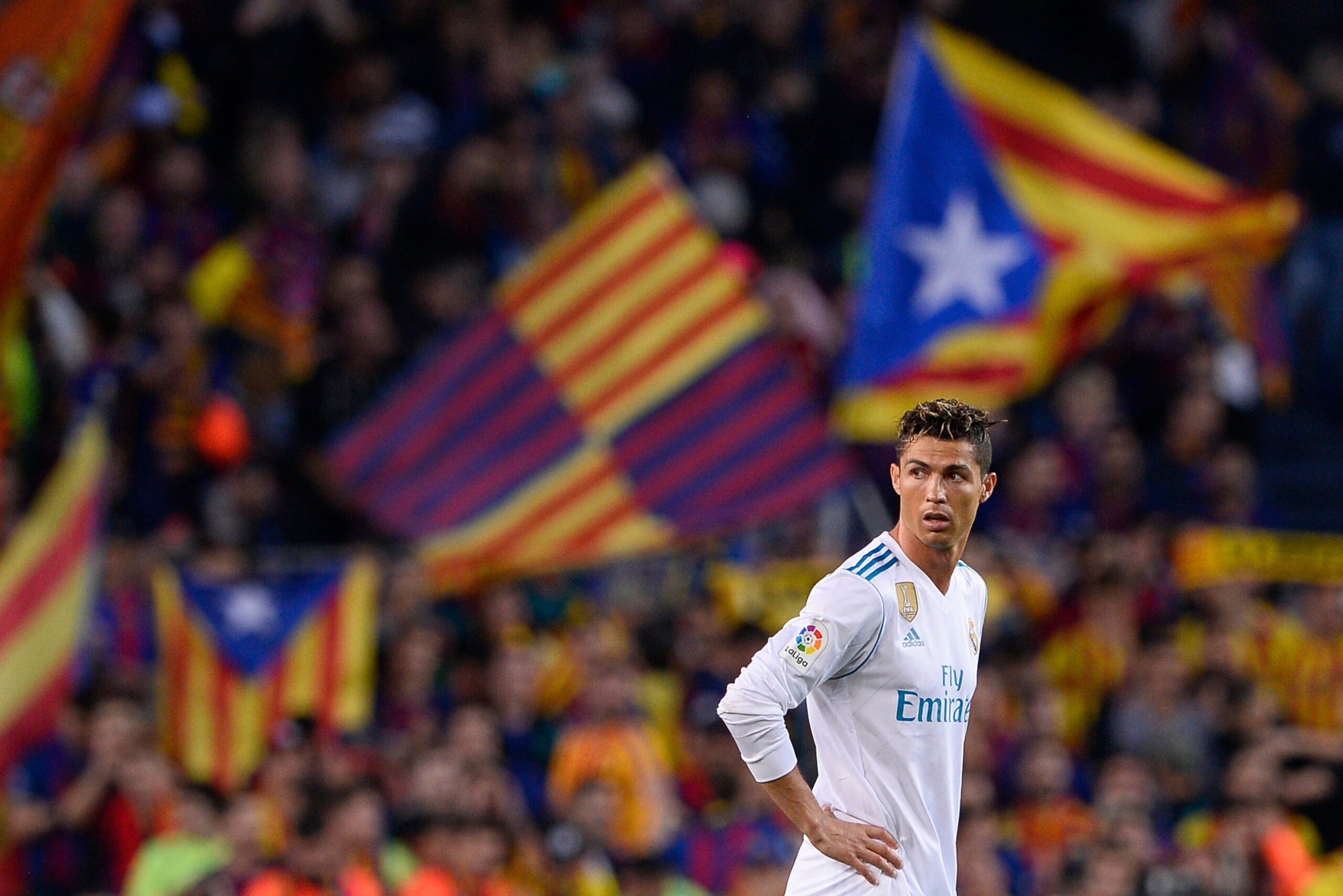 Real Madrid's Portuguese forward Cristiano Ronaldo stands on the field after Barcelona's goal during the Spanish league football match between FC Barcelona and Real Madrid CF at the Camp Nou stadium in Barcelona on May 6, 2018. (Photo by Josep LAGO / AFP)
