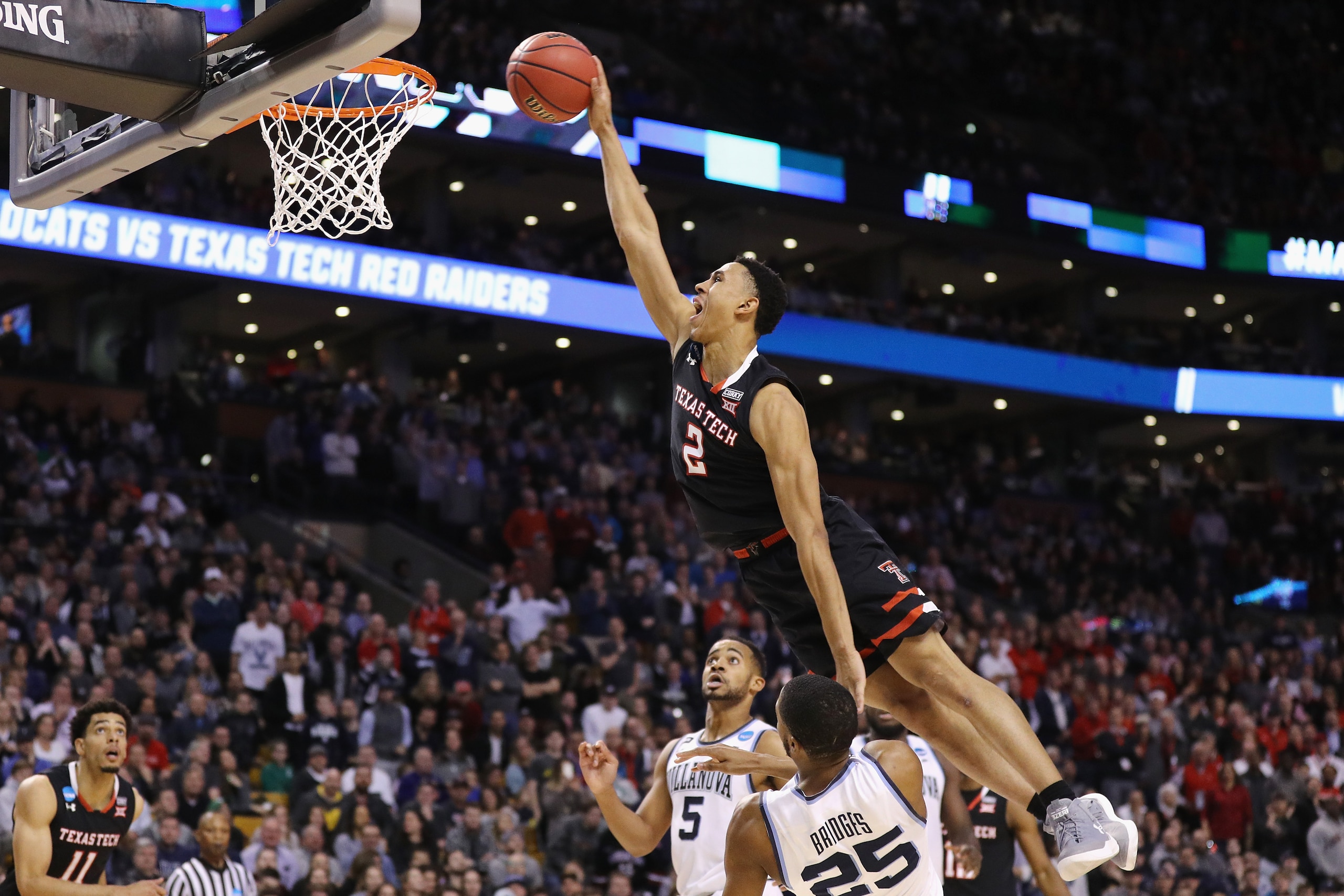 BOSTON, MA - MARCH 25: Zhaire Smith #2 of the Texas Tech Red Raiders attempts to dunk the ball against Mikal Bridges #25 of the Villanova Wildcats during the second half in the 2018 NCAA Men's Basketball Tournament East Regional at TD Garden on March 25, BOSTON, MA - MARCH 25: Zhaire Smith #2 of the Texas Tech Red Raiders attempts to dunk the ball against Mikal Bridges #25 of the Villanova Wildcats during the second half in the 2018 NCAA Men's Basketball Tournament East Regional at TD Garden on March 25,