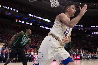 PHILADELPHIA, PA - MAY 7: T.J. McConnell #12 of the Philadelphia 76ers reacts in front of Terry Rozier #12 of the Boston Celtics after making a lay up in the third quarter during Game Four of the Eastern Conference Second Round of the 2018 NBA Playoffs at