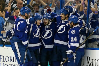 TAMPA, FL - MAY 8:  Victor Hedman #77, Matt Carle #25,Cedric Paquette #13 and Ryan Callahan #24 celebrate a goal by Brian Boyle #11 of the Tampa Bay Lightning against the New York Islanders during the first period of Game Five of the Eastern Conference Se