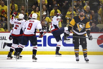 PITTSBURGH, PA - MAY 07: Evgeny Kuznetsov #92 of the Washington Capitals celebrates his overtime winning goal to win the series against the Pittsburgh Penguins in Game Six of the Eastern Conference Second Round during the 2018 NHL Stanley Cup Playoffs at 