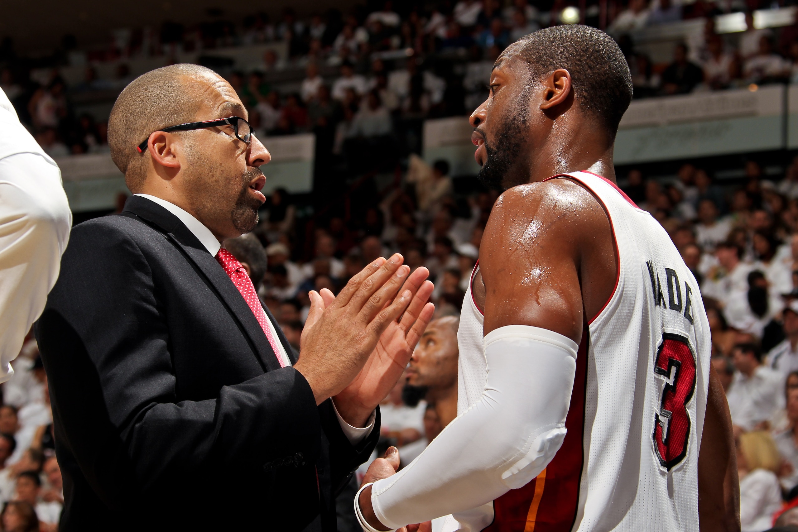 MIAMI, FL - MAY 8: David Fizdale, assistant coach of the Miami Heat, speaks with Dwyane Wade #3 as the team plays the Chicago Bulls in Game Two of the Eastern Conference Semifinals during the 2013 NBA Playoffs on May 8, 2013 at American Airlines Arena in MIAMI, FL - MAY 8: David Fizdale, assistant coach of the Miami Heat, speaks with Dwyane Wade #3 as the team plays the Chicago Bulls in Game Two of the Eastern Conference Semifinals during the 2013 NBA Playoffs on May 8, 2013 at American Airlines Arena in